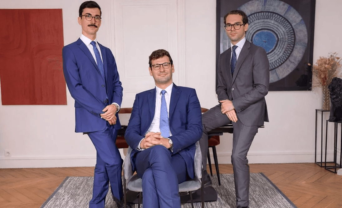 woman sitting around table holding tablet