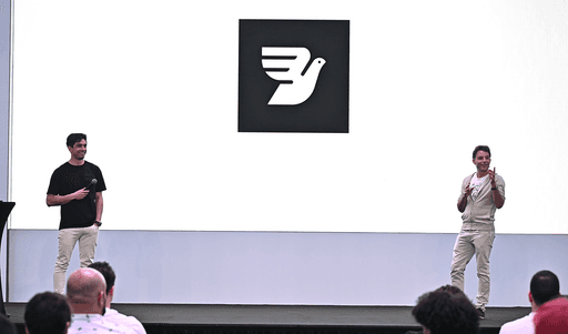 Bird founder Robert Vis delivering his key note speech in Dubai with the Bird logo displayed in the background.