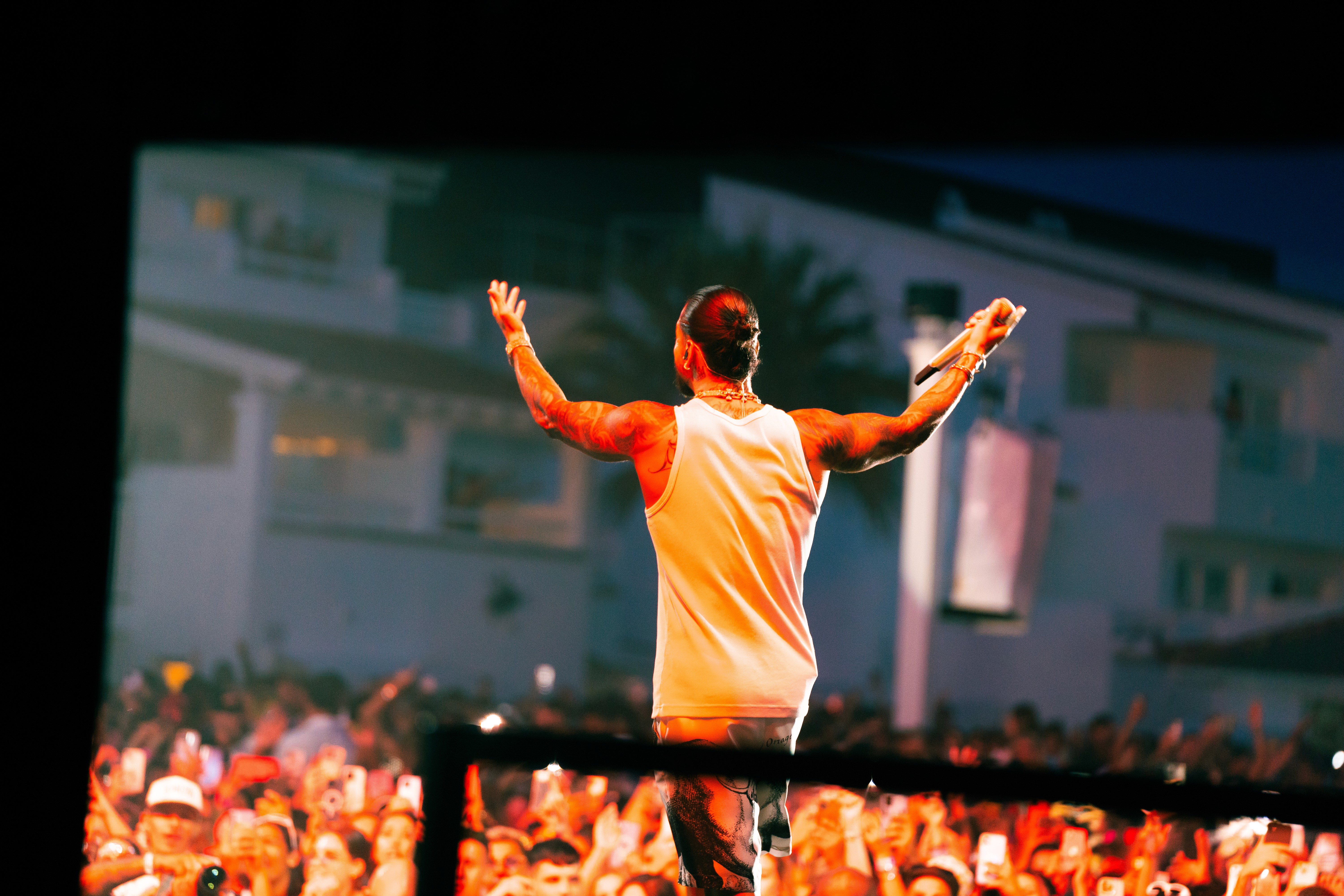 A woman with a head made of mirrors, reflecting light and creating a kaleidoscopic effect around her.