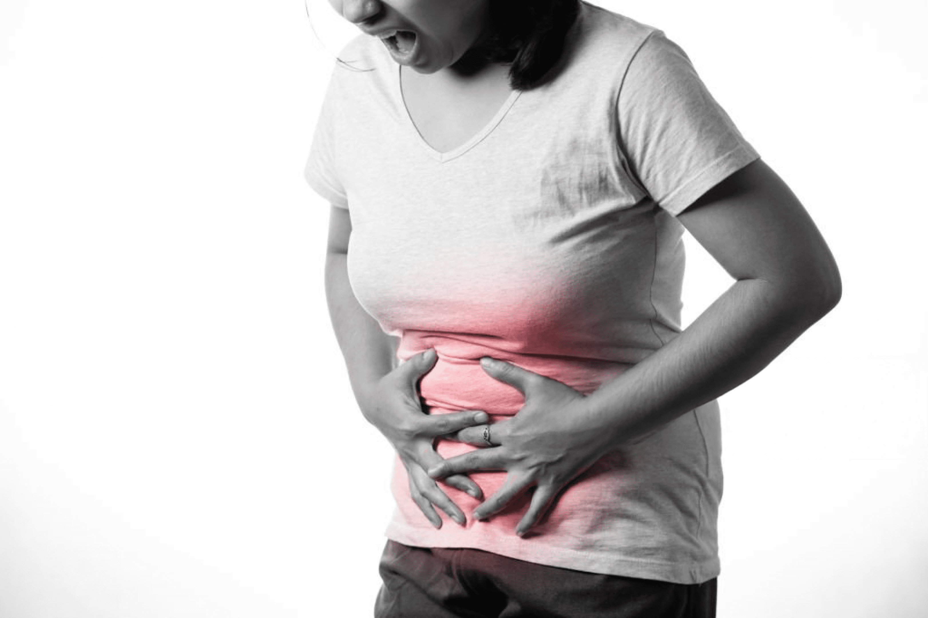 Black and white image of a woman clutching stomach due to gastrointestinal pain