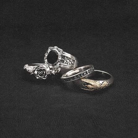 Silver jewelry on a dark background