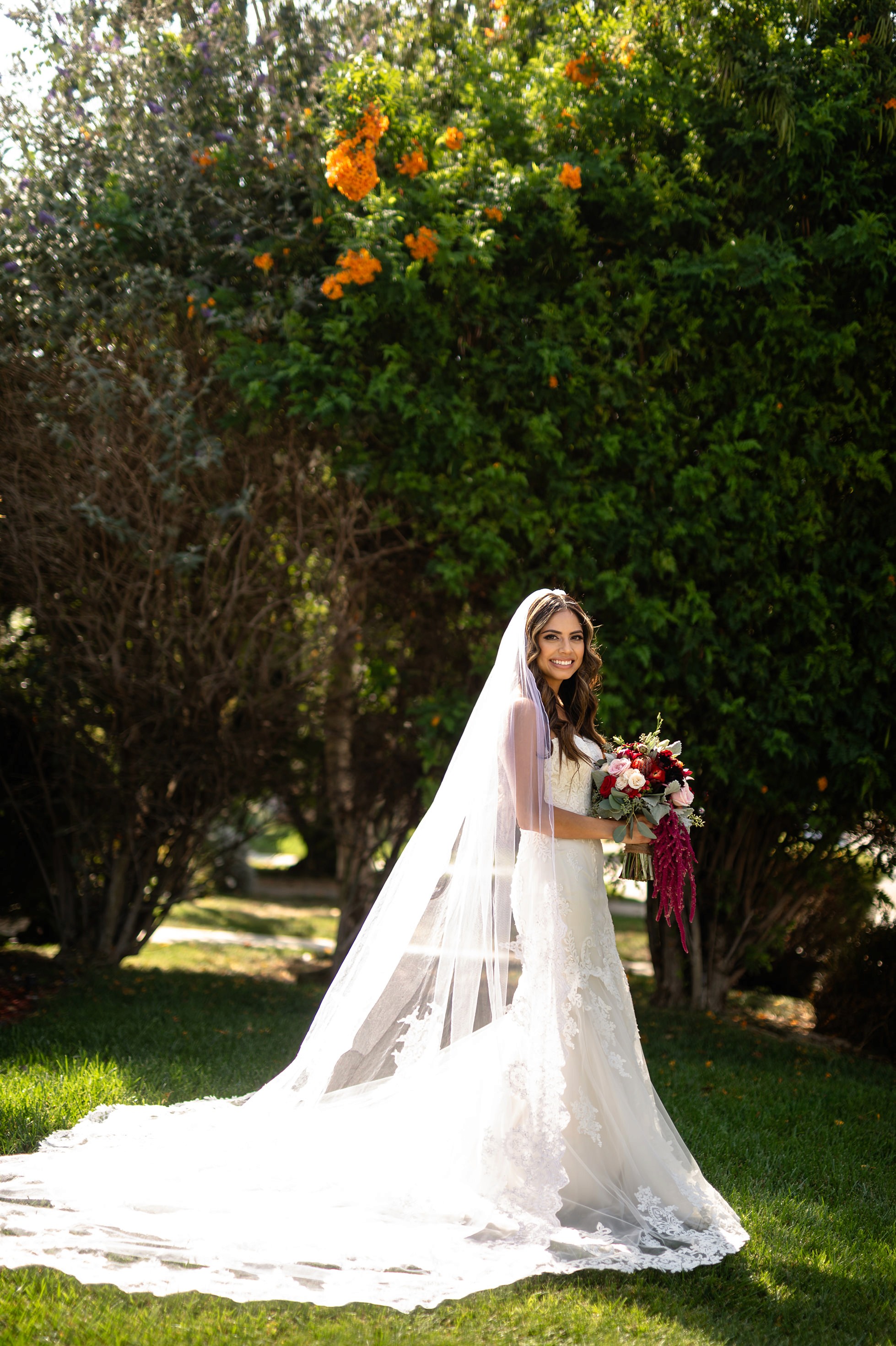 Flat lay wedding details with bouquet, rings, and sparkling bridal heels