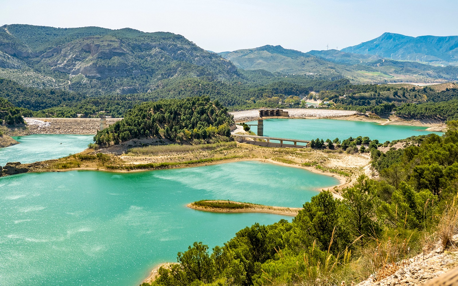 Caminito del Rey landscape with turquoise lakes and surrounding mountains in Málaga, Spain.