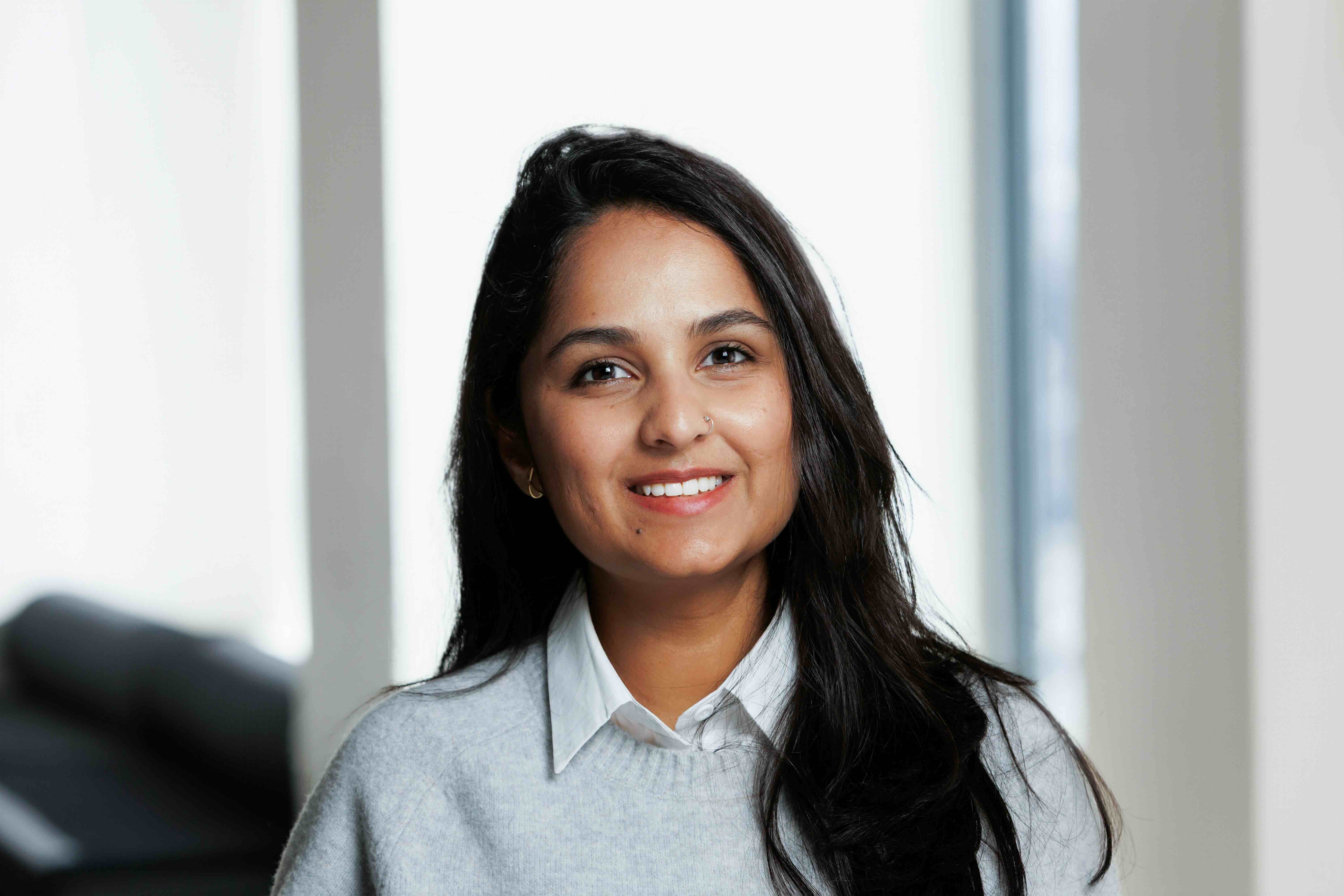 Soft, monochrome photo of white flowers with shallow depth of field and diffused window light.