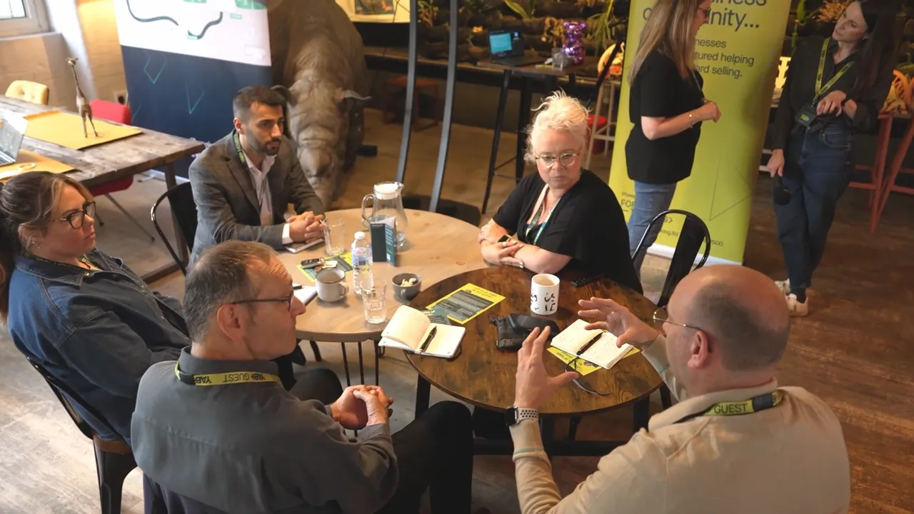 Business professionals networking and discussing ideas during the YAB corporate event in Manchester, captured as part of a corporate event video production project.