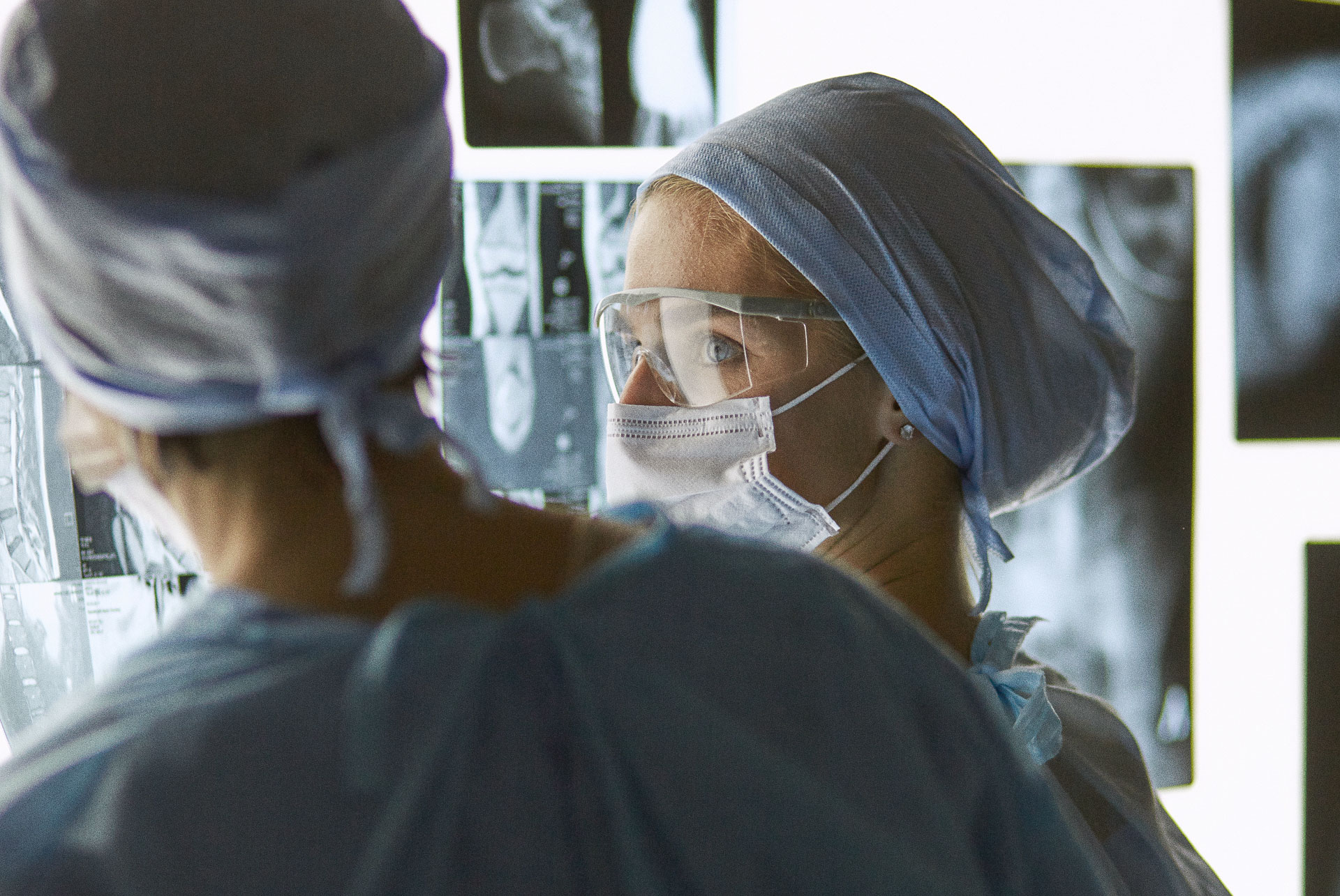 Surgical team performing procedure in hospital operating room