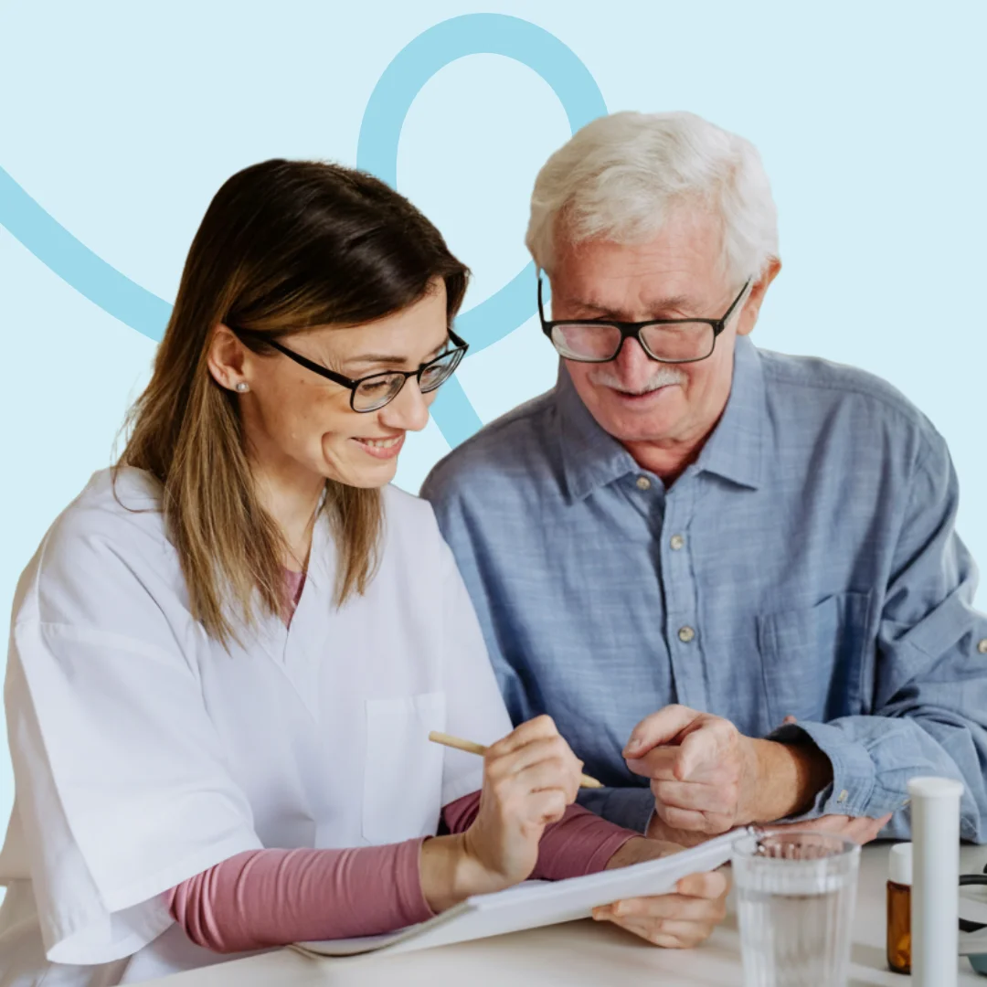 Client reviewing health monitoring notes with community nurse at home in Brisbane