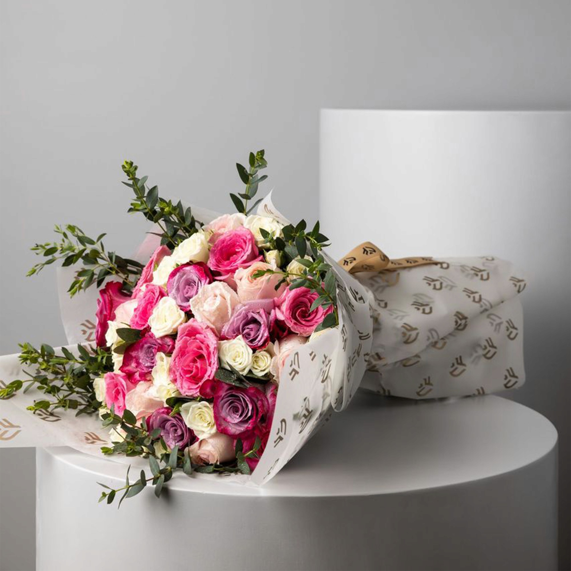 Creation Flowers bouquet wrapped in branded paper
