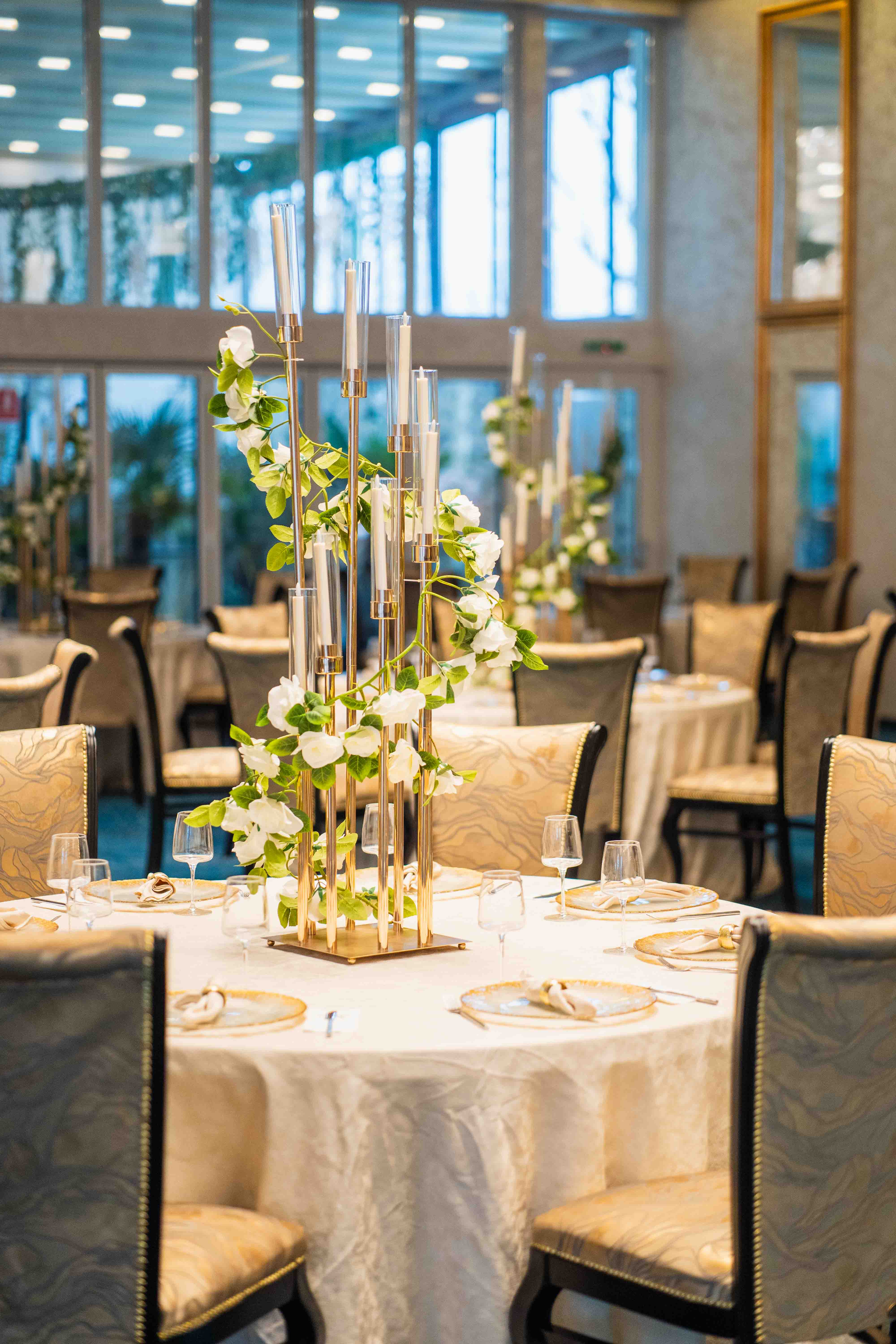 Modern bathroom featuring wooden cabinetry, a bathtub, a sleek sink, and natural light from a window.
