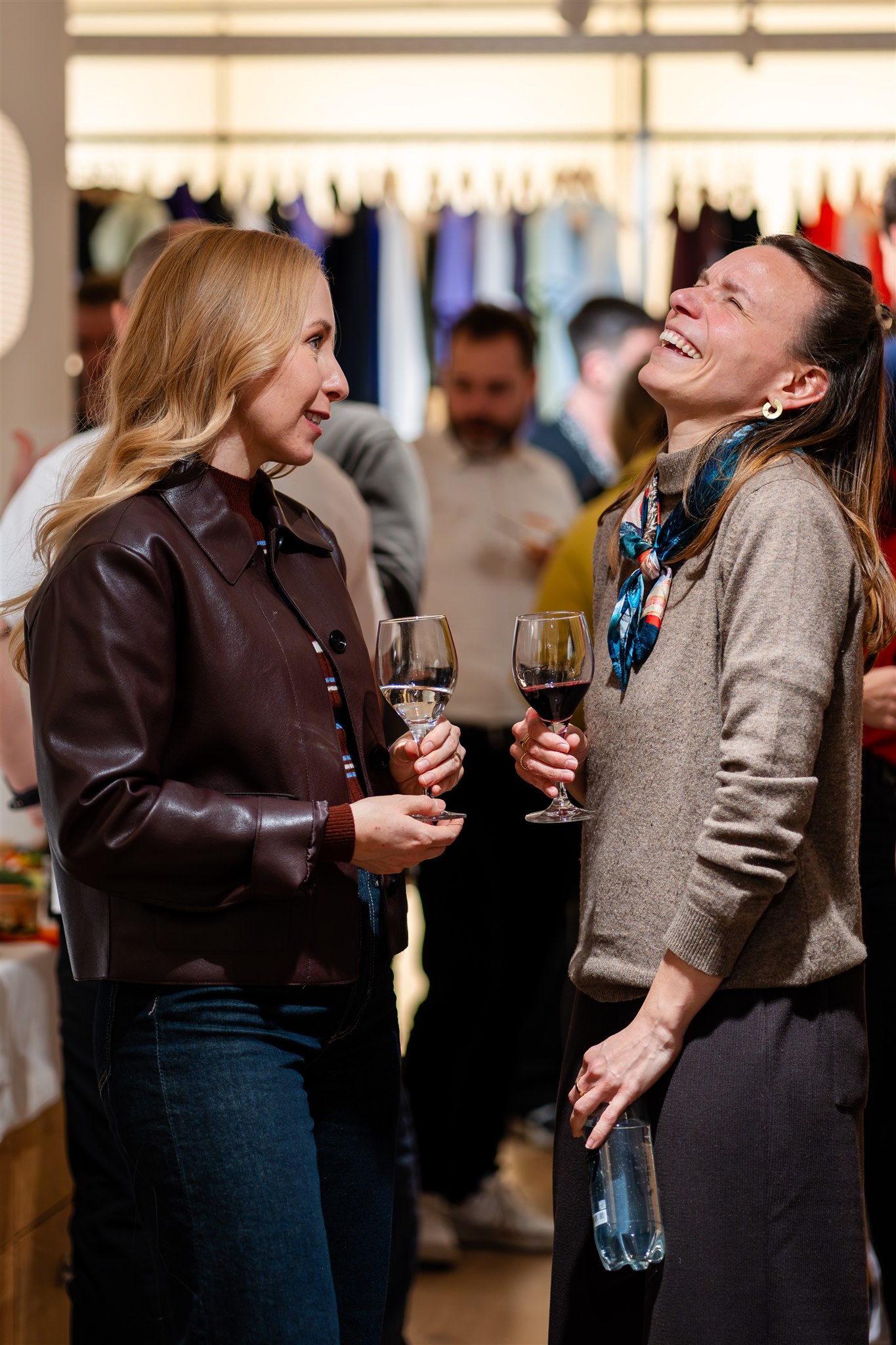 Guests laughing during networking event in Zurich