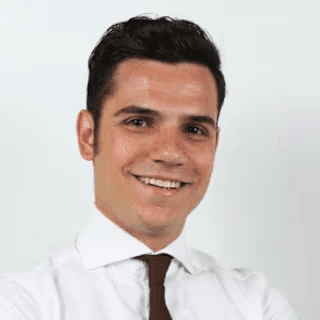 man wearing black notched lapel suit jacket in focus photography