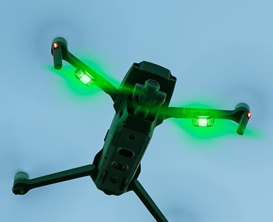 two people looking at a tablet and smiling