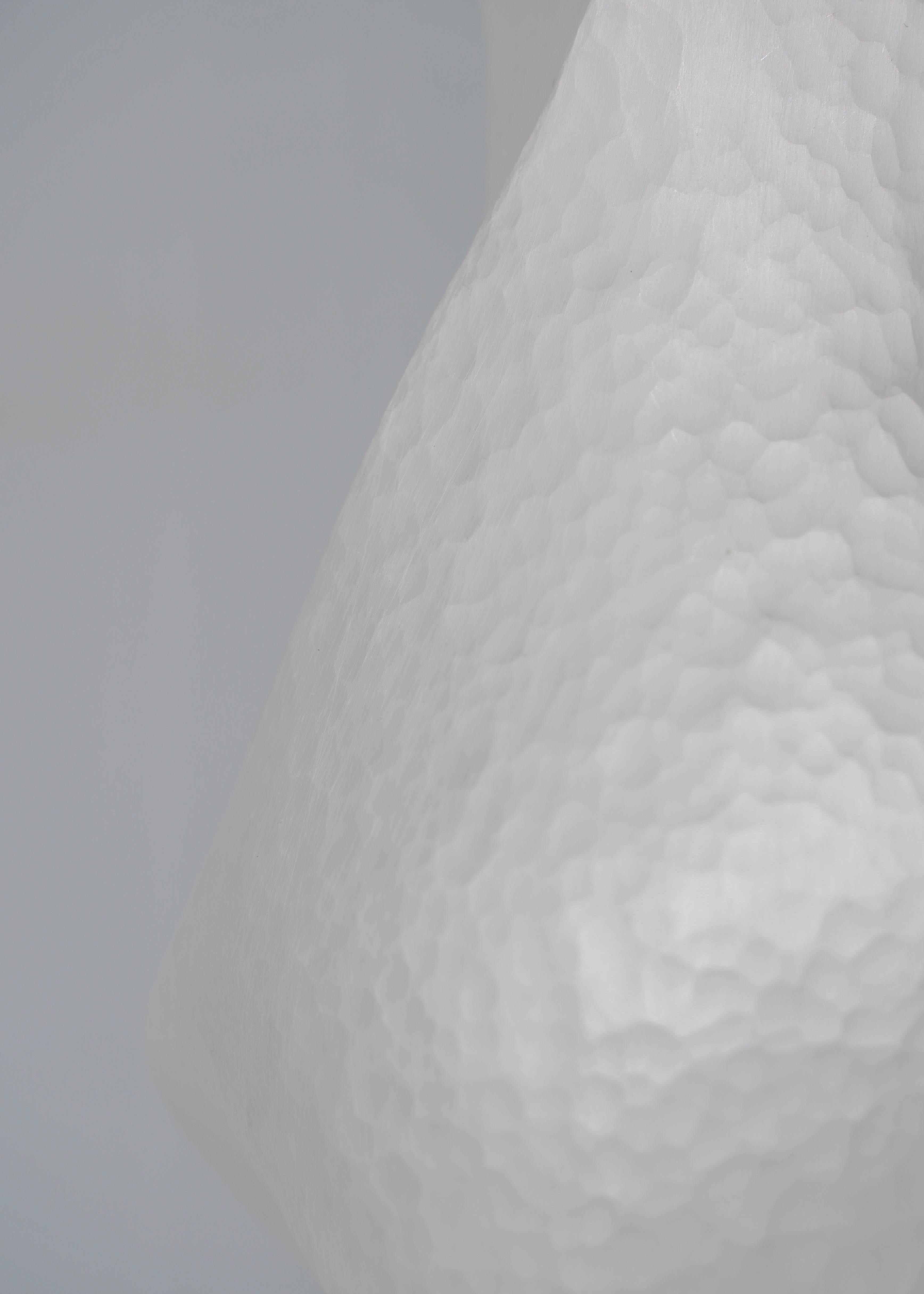 Close-up of Constrict by Yuxin Song, hand-forged fine silver vase. Contemporary silversmithing and metalwork by artist Yuxin Song