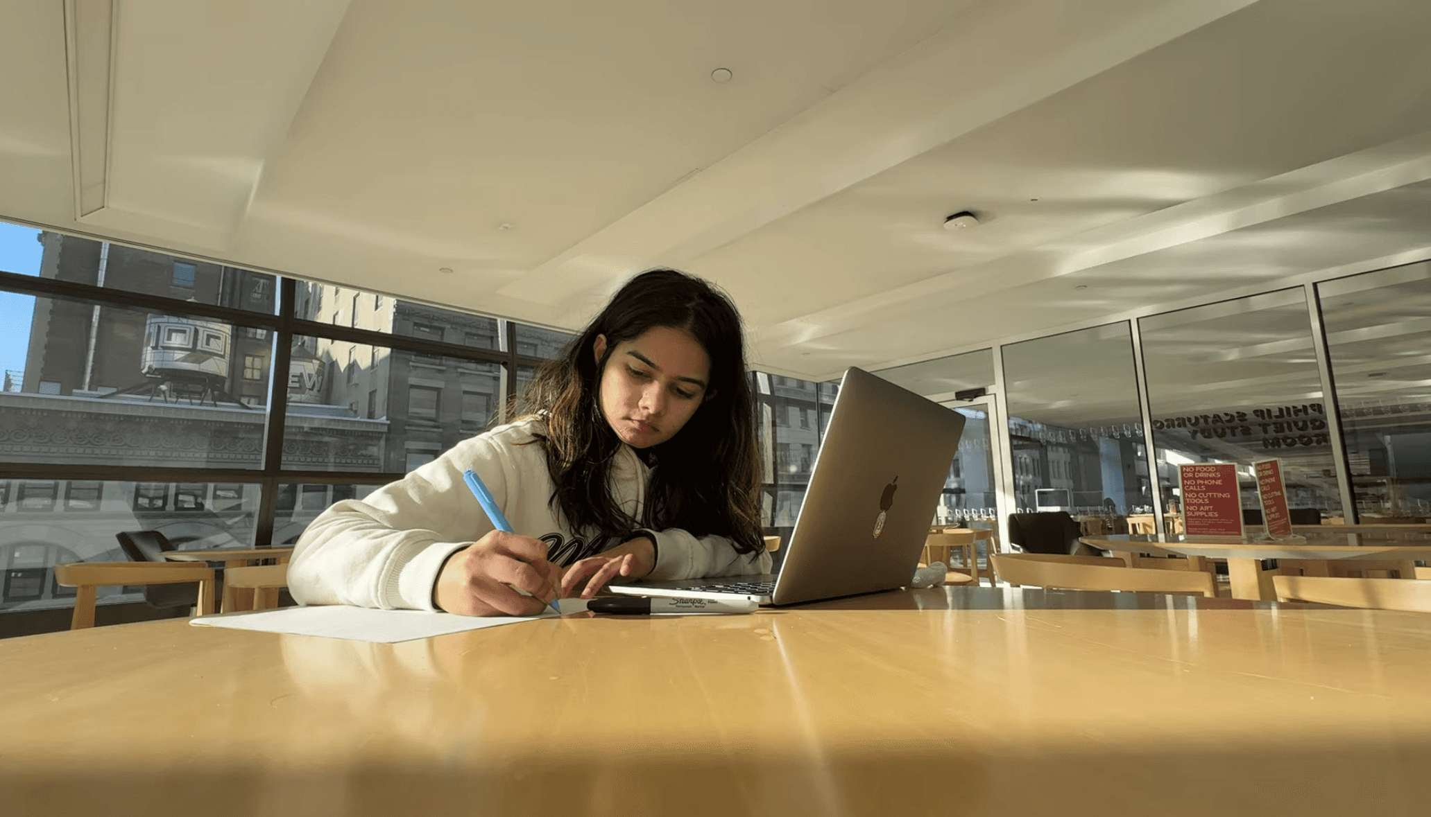 Fashion photoshoot with a woman posing in a dress