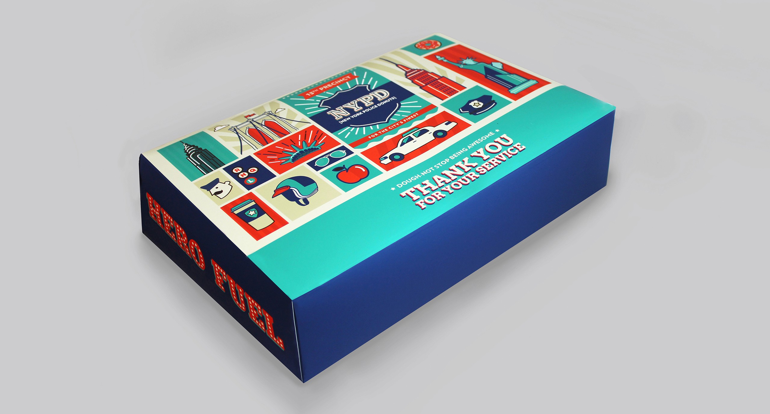 A box with the New York city landmarks and NYPD logo on it. There is also the text: Thank you for your service. Hero Fuel.