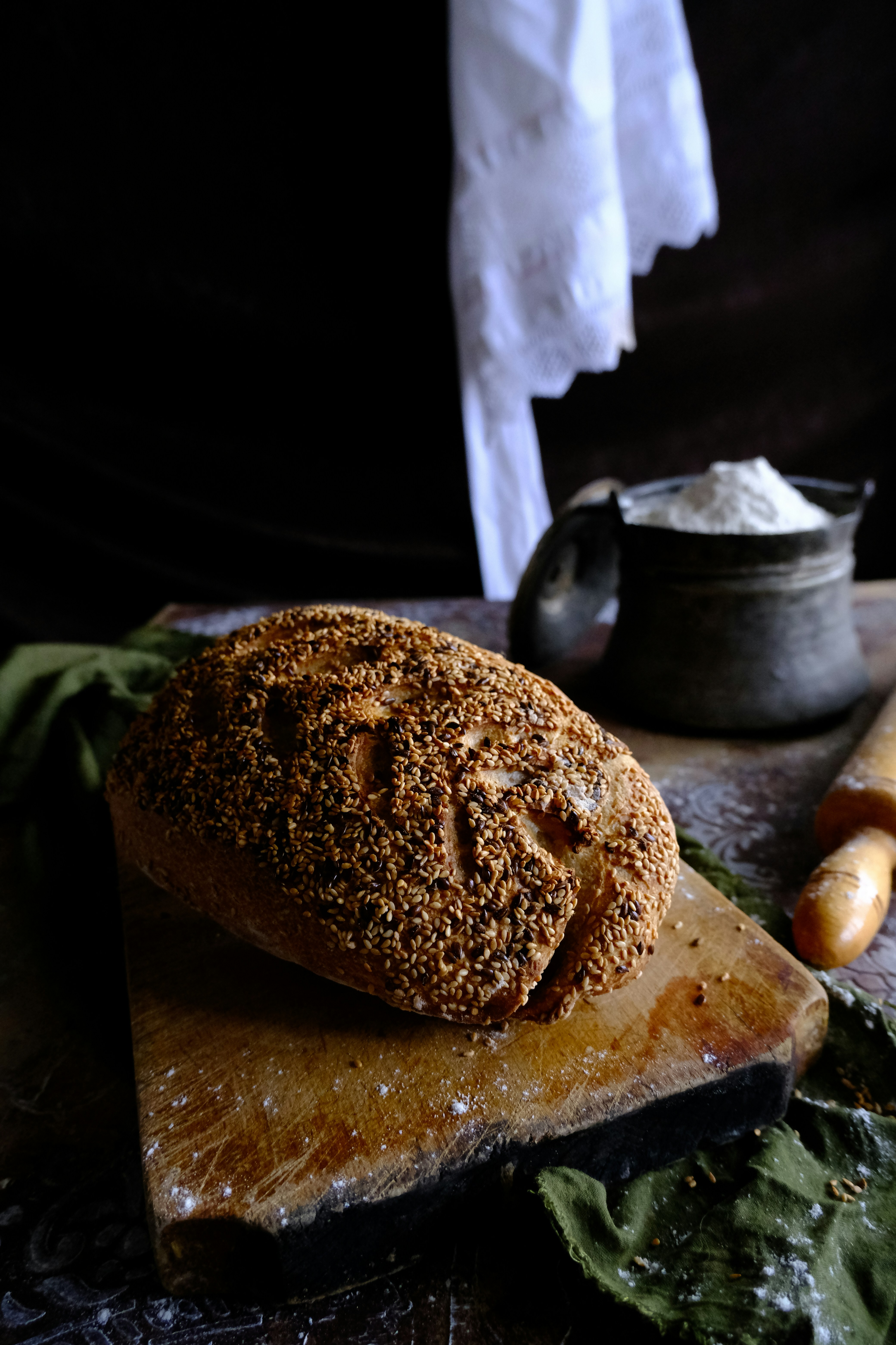 a loaf of bread sitting on top of a cutting board