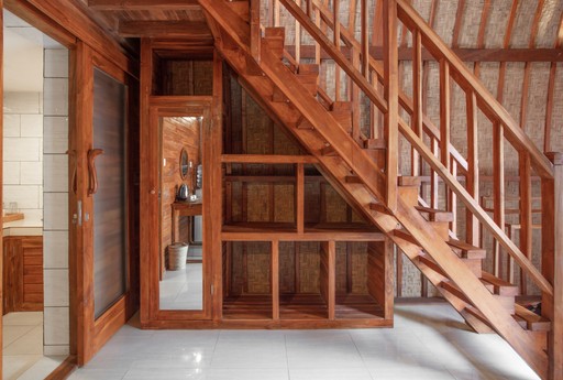 Close-up of a tree stump showing growth rings and a textured brown wood surface.