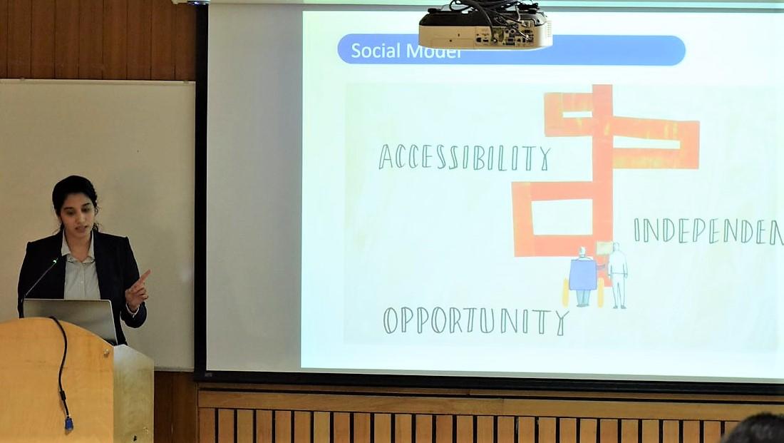 Gurusha Raskar presenting a slide on accessibility, independence and opportunity to a lecture hall