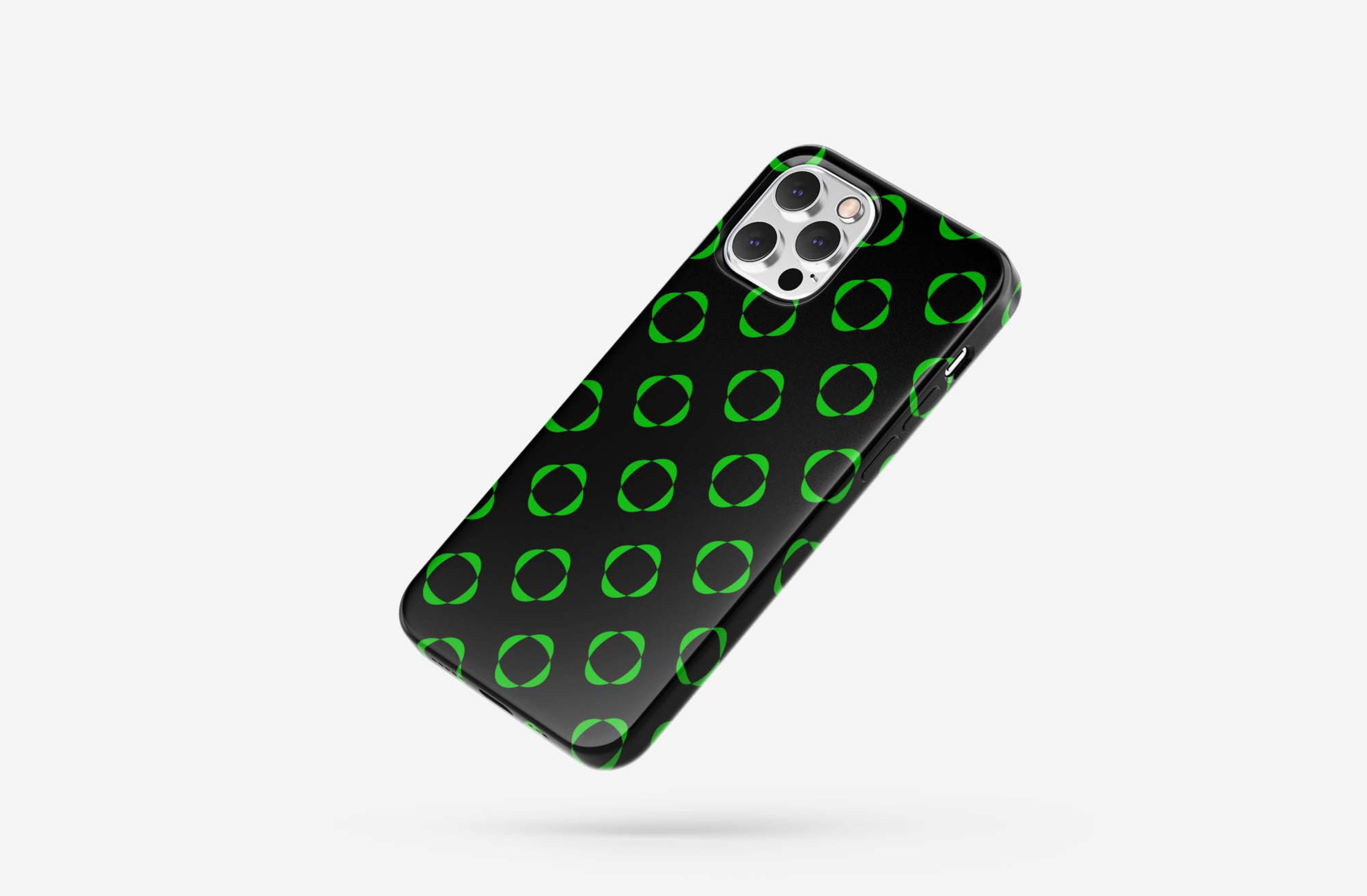 Stylish black phone case with green circular pattern.