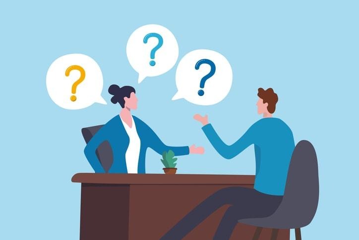 A diverse team of professionals is engaged in a collaborative discussion, employing their problem-solving skills to navigate a significant challenge during a project. They communicate effectively, sharing ideas and strategies to overcome obstacles and ensure positive outcomes despite tight deadlines and external factors.