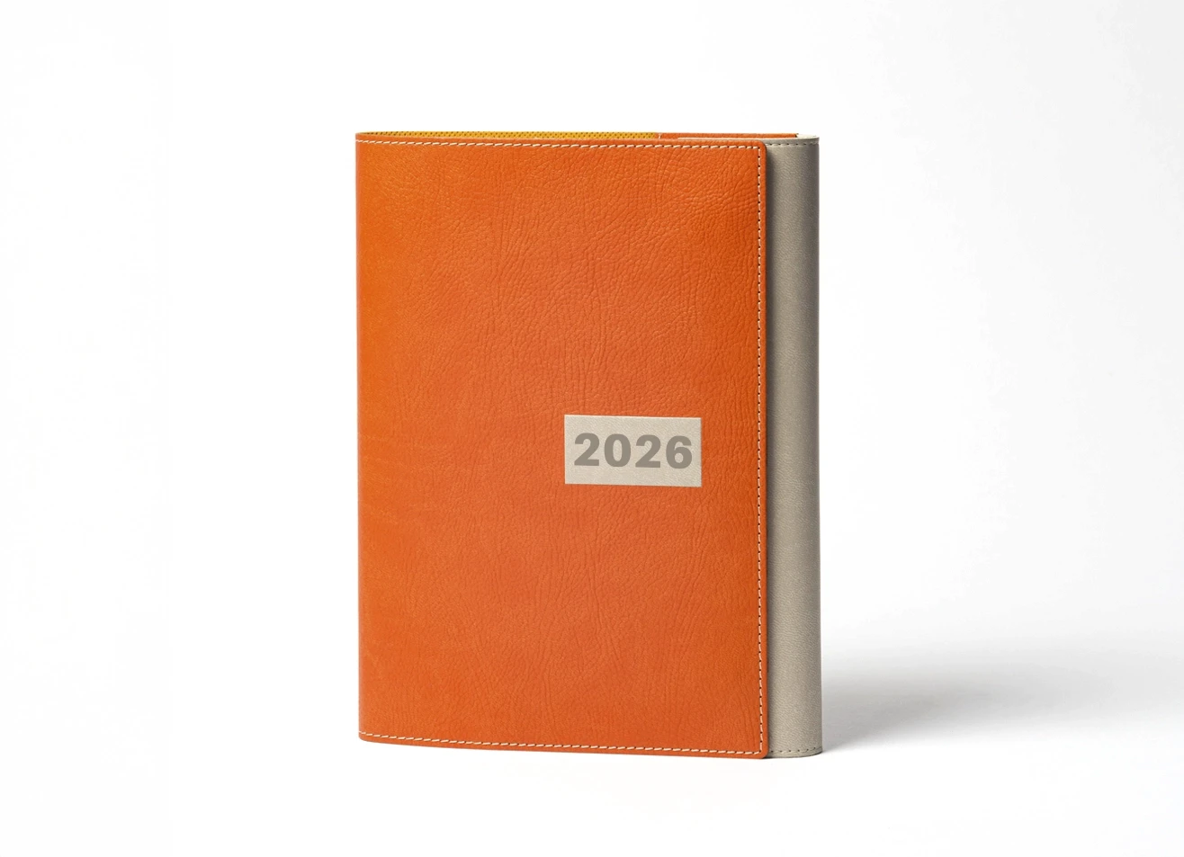 Front view of tan leather 2026 journal with grey spine and stitched edges