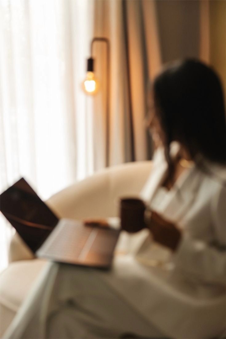 person holding black ipad with green plant