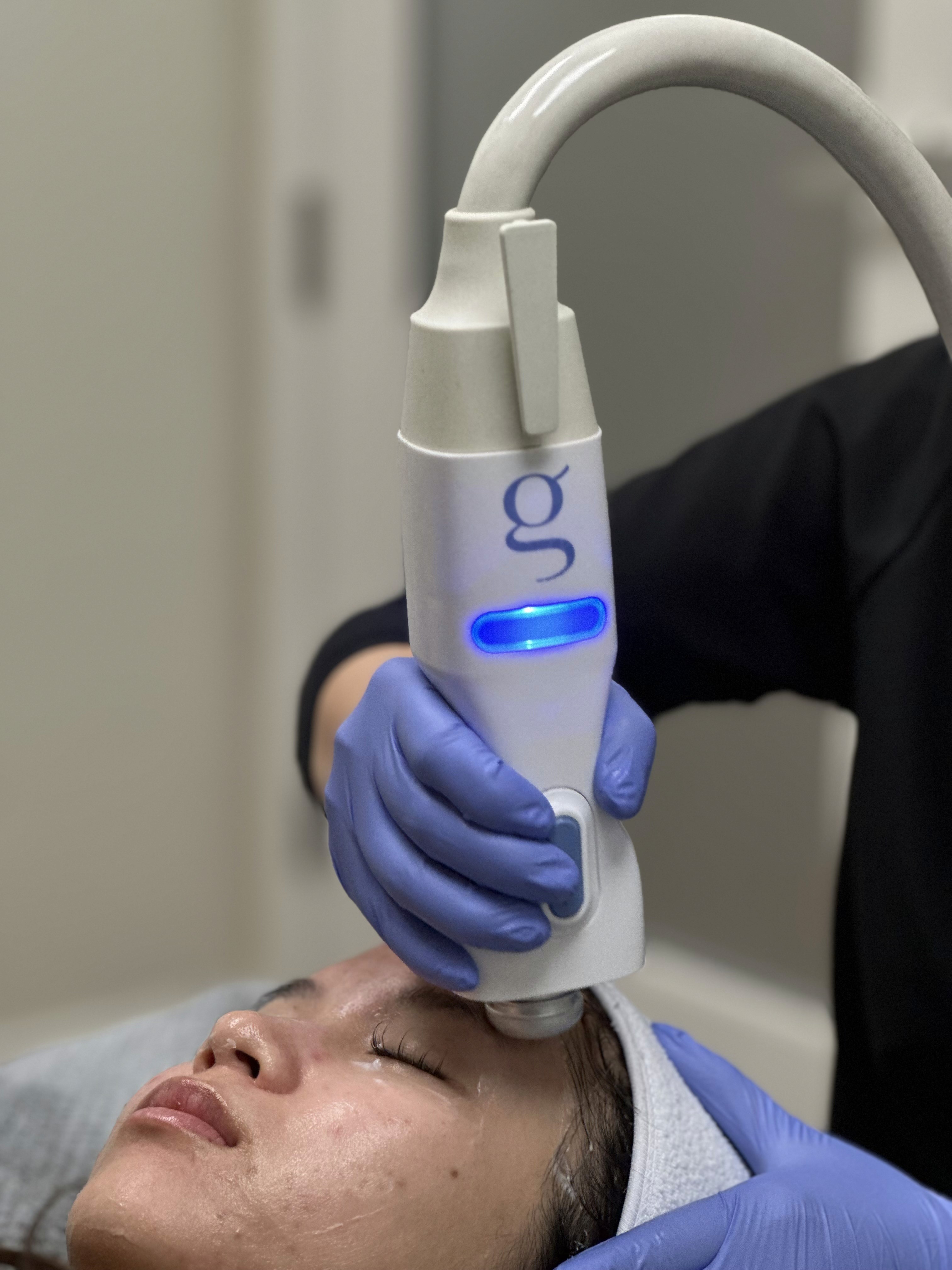 Patient receiving a Glacial Gloss cryo facial treatment.