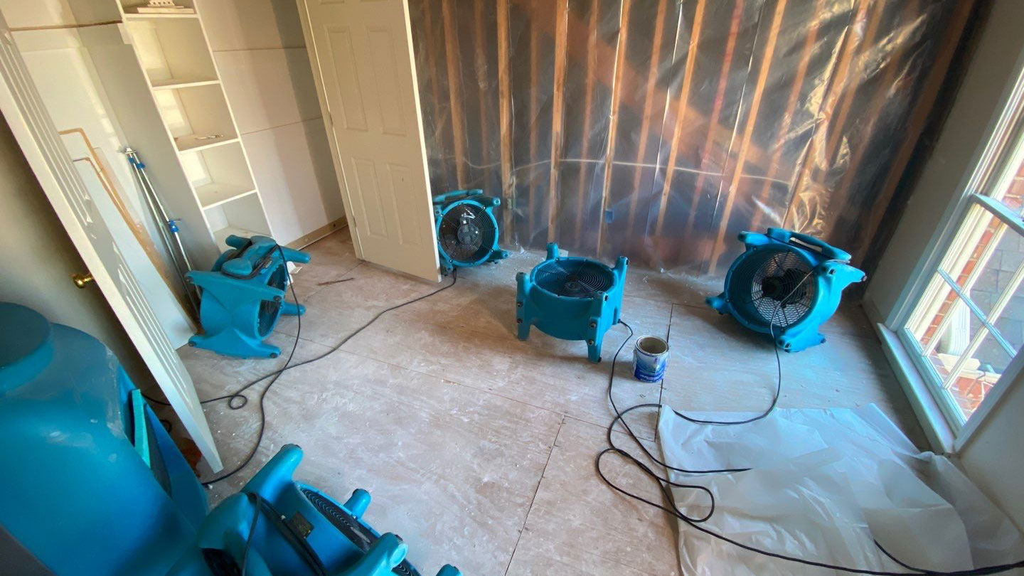 Woman talking on a mobile phone in a kitchen.