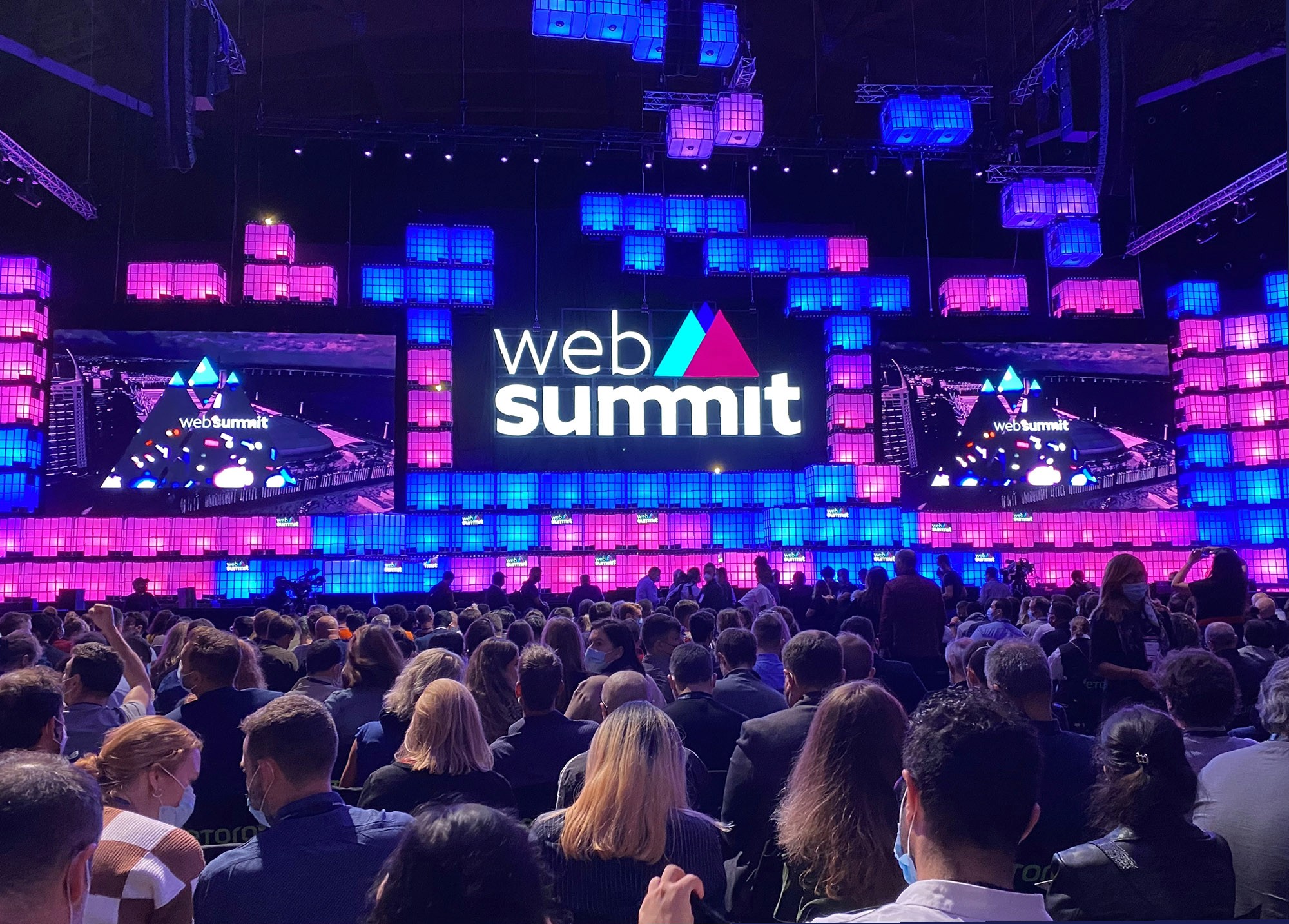 a group of people walking on a sidewalk