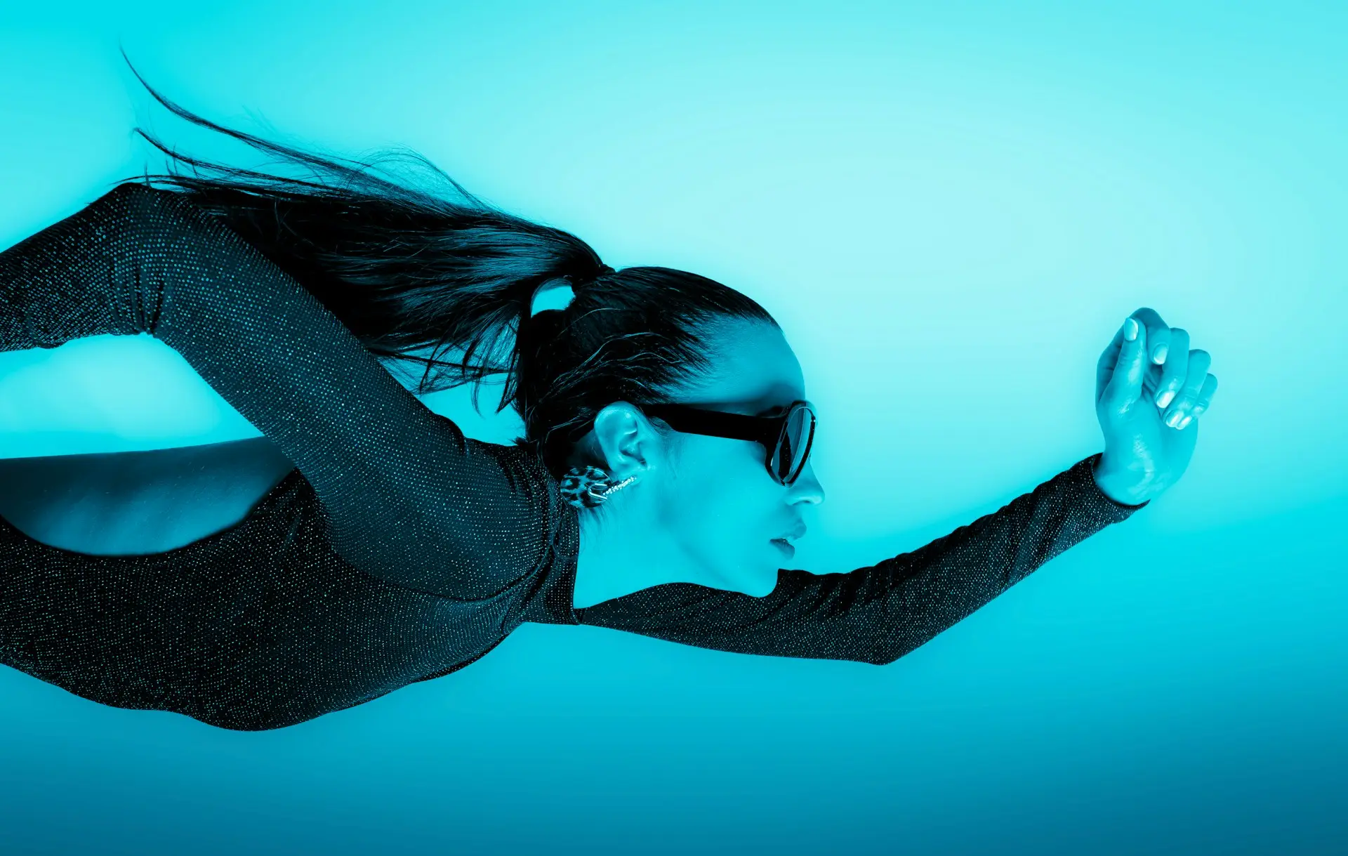 woman diving in blue water