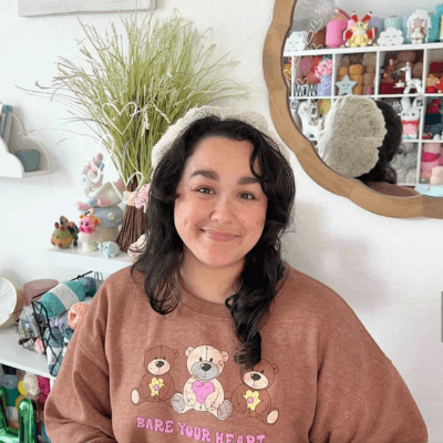 man in brown leather jacket smiling