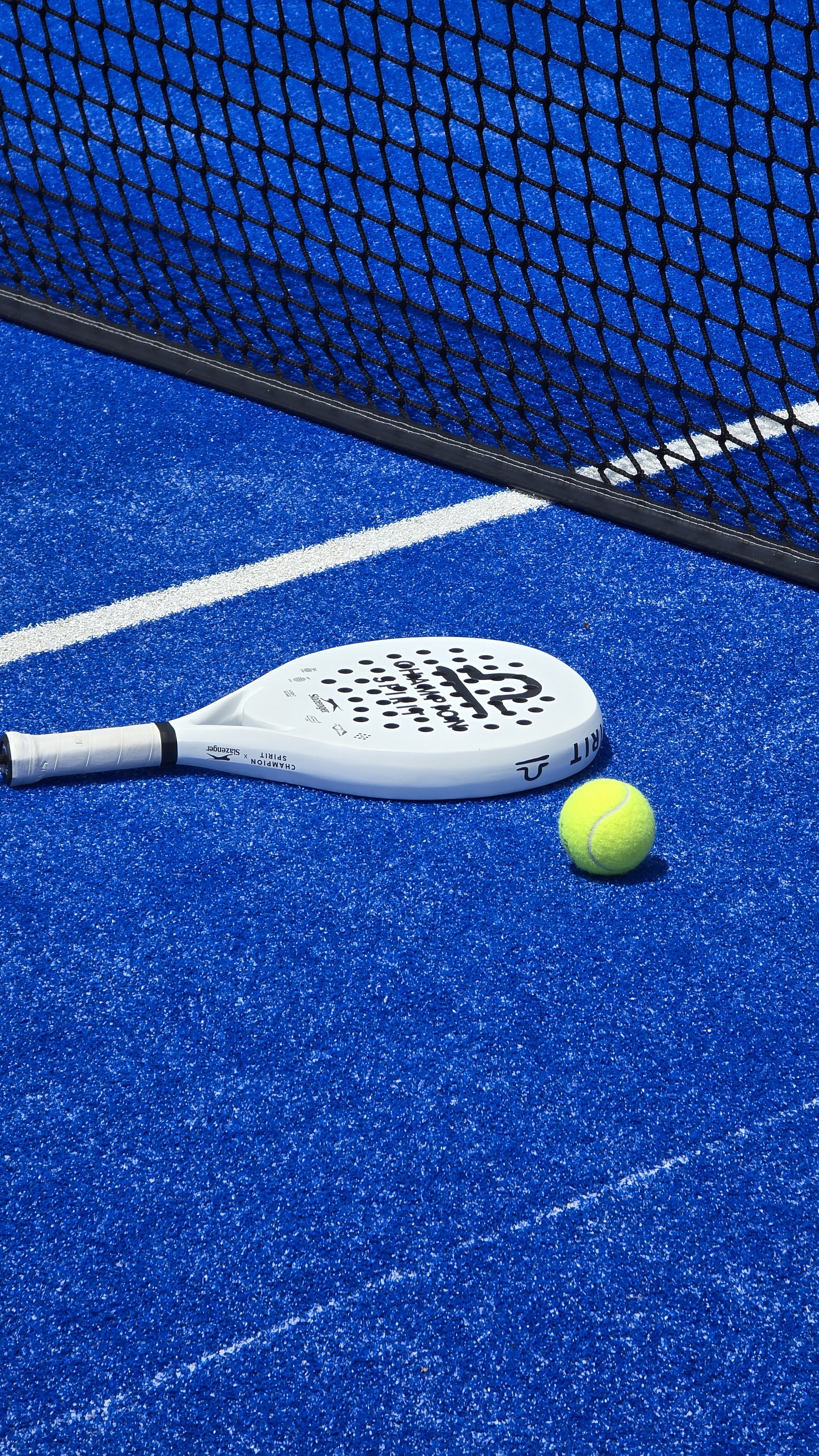 yellow and white tennis racket