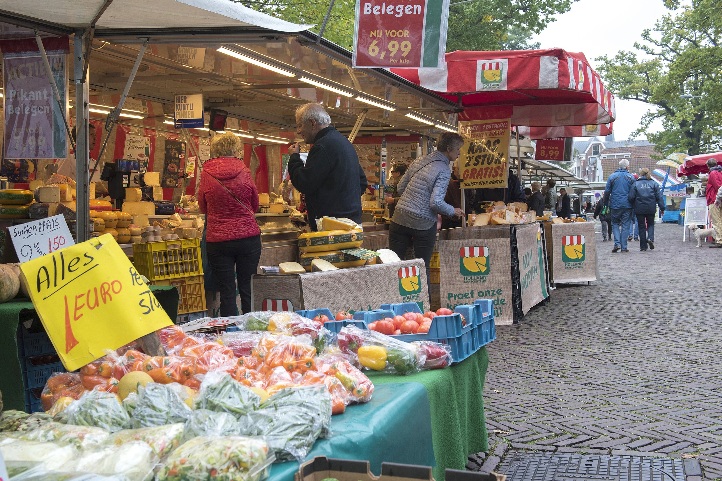 two people looking at a tablet and smiling