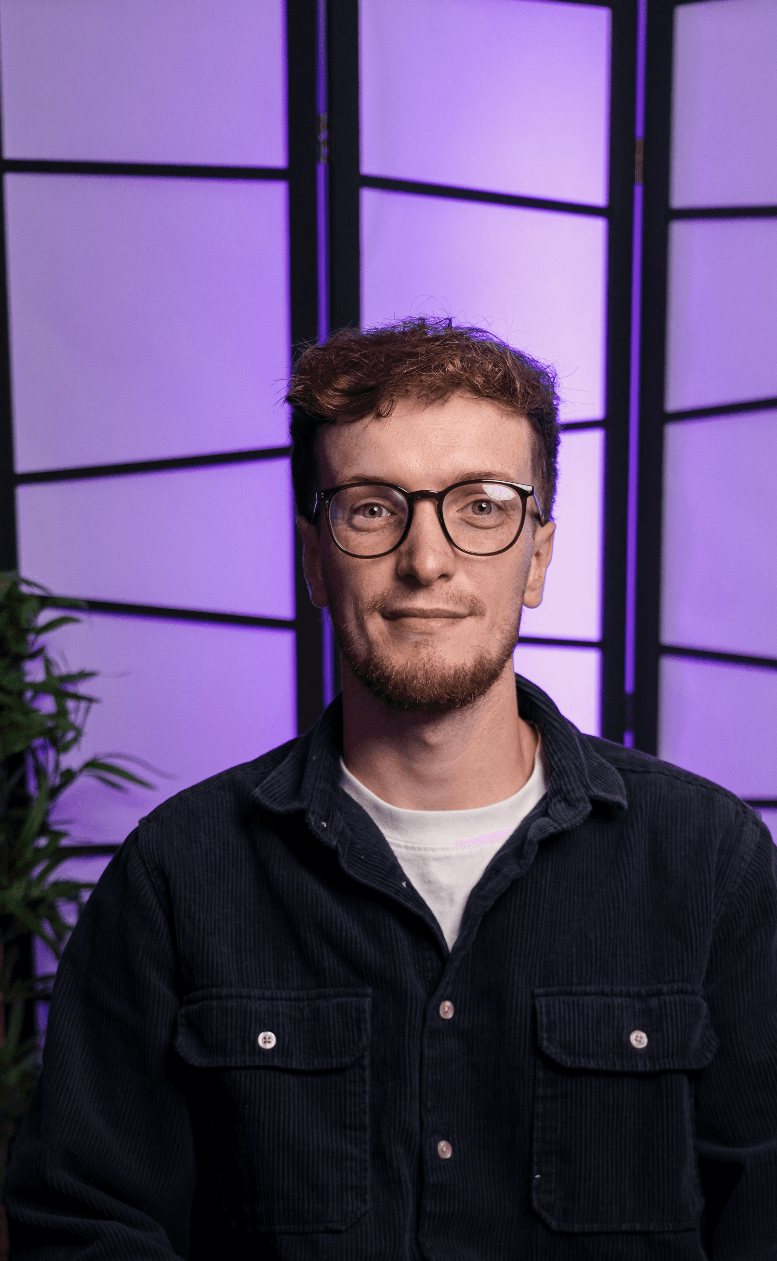 man in green crew neck shirt and black hat