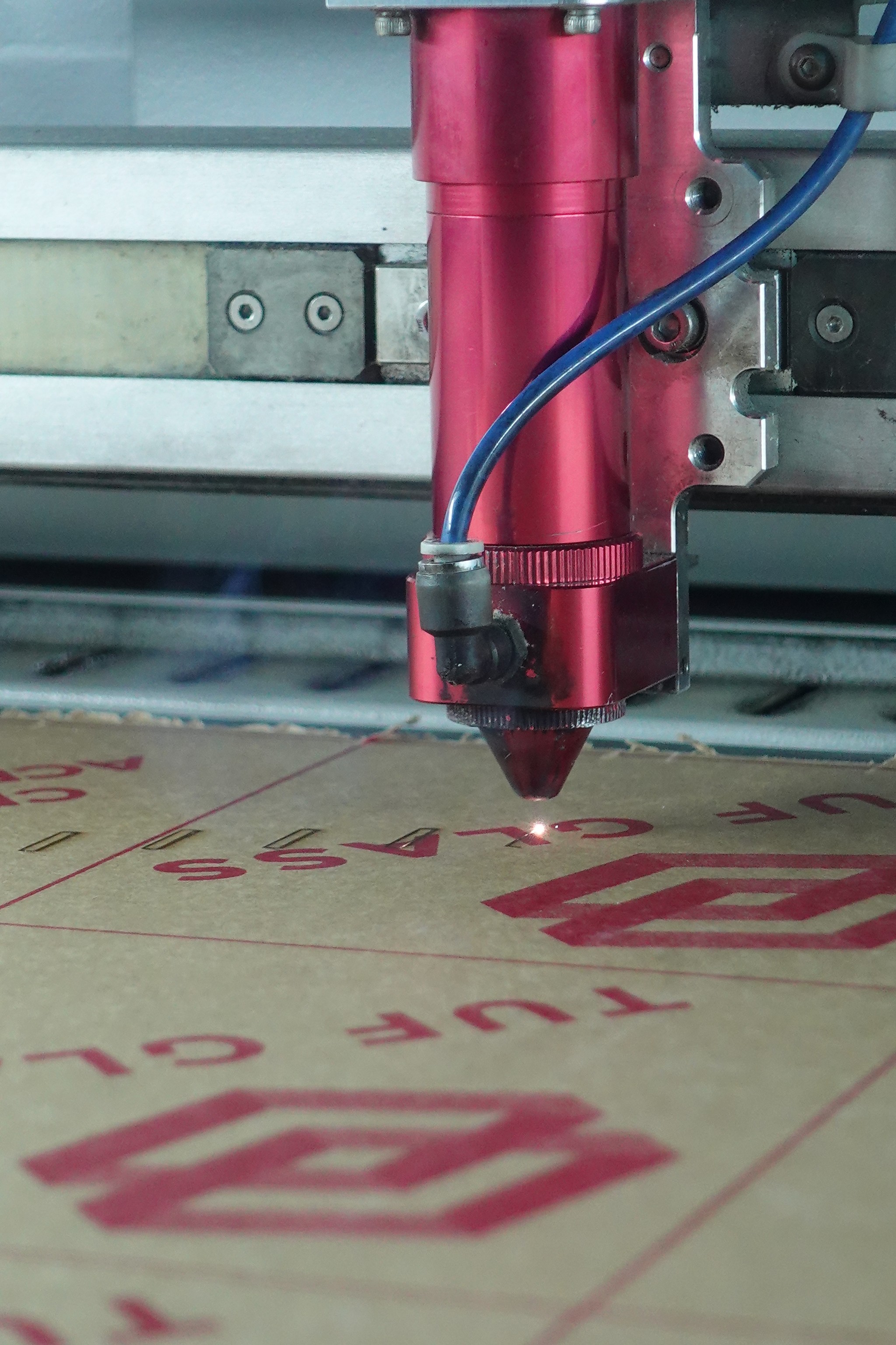 Laser Cutting machine cutting through meta with extreme heat and precision.