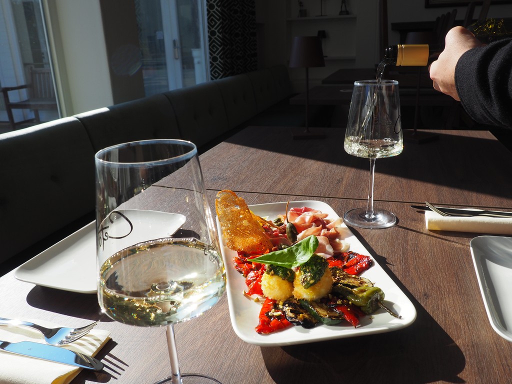 two glass of iced tea with some orange fruit around them