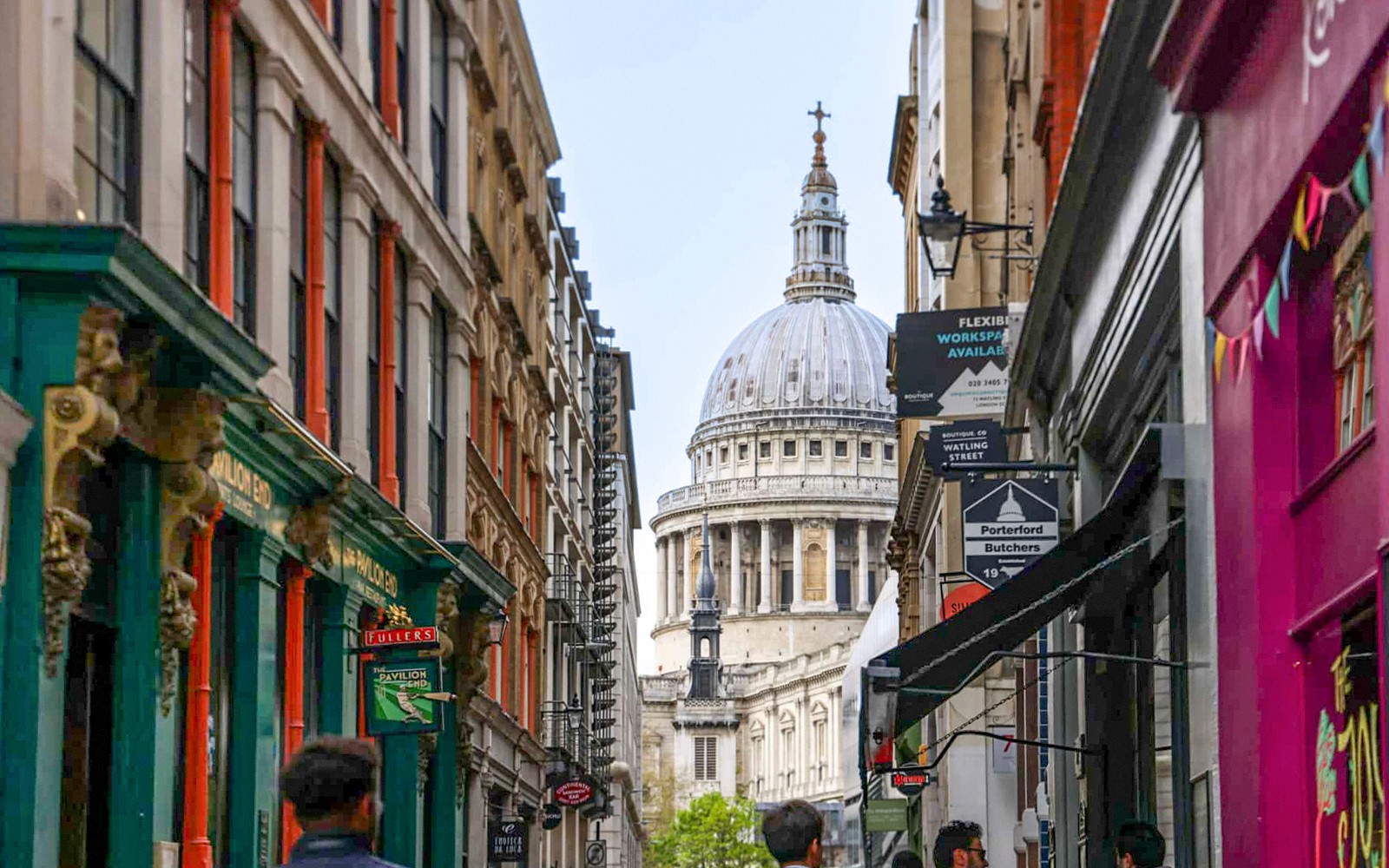 Narrow London street with view of St. Paul's Cathedral dome, part of Eating London food tour.