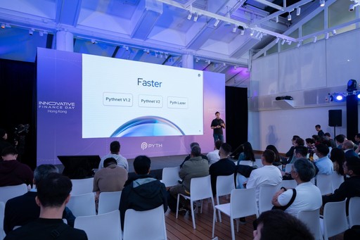 A speaker presents on stage at the Pyth “Innovative Finance Day” event in Hong Kong. The slide on the large screen reads “Faster,” showing progressions labeled “Pythnet V1.2,” “Pythnet V2,” and “Pyth Laser.” The audience sits in white chairs under blue lighting inside a modern venue.