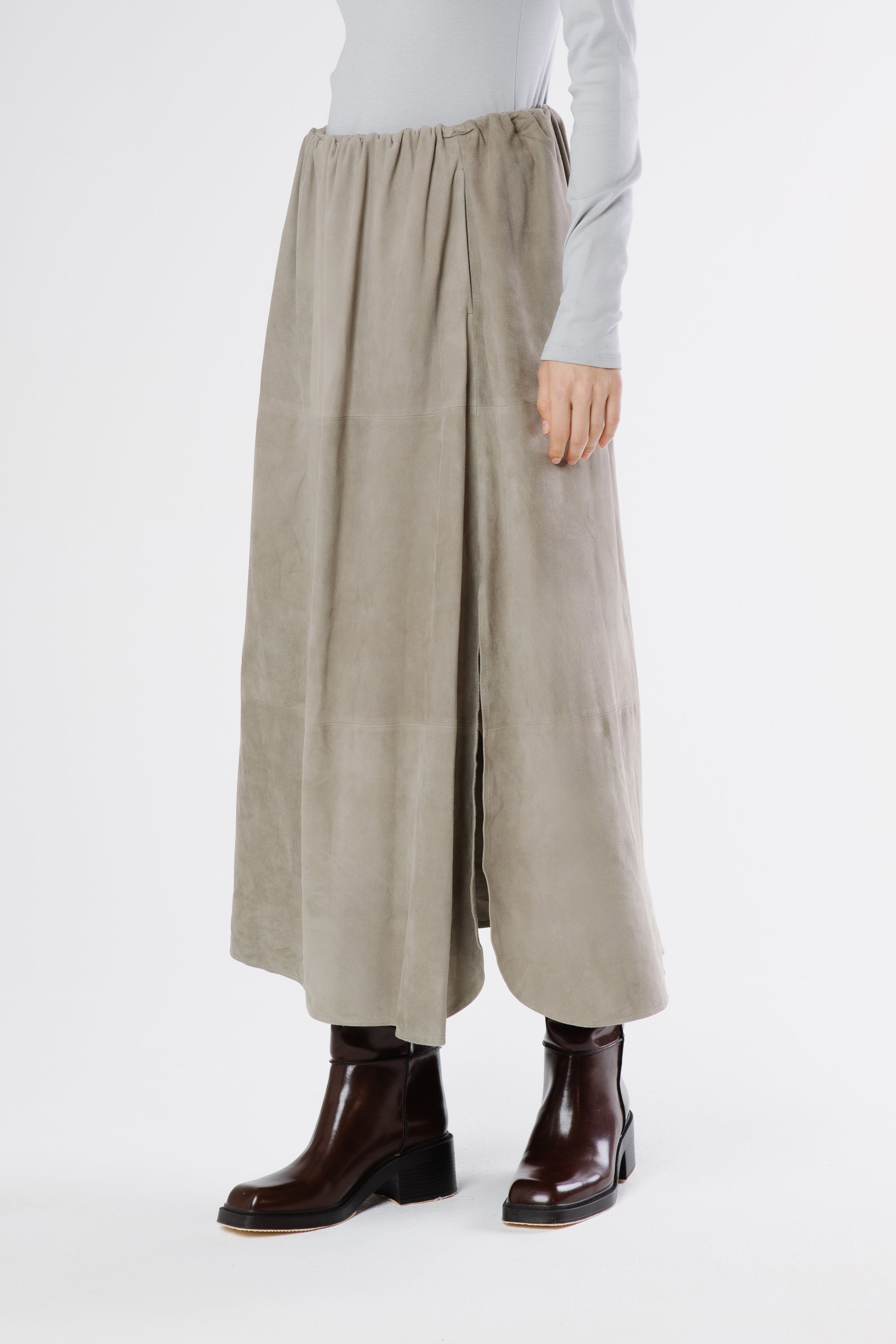 Close-up of soft suede texture in drizzle grey tone showing luxurious finish and fine stitching