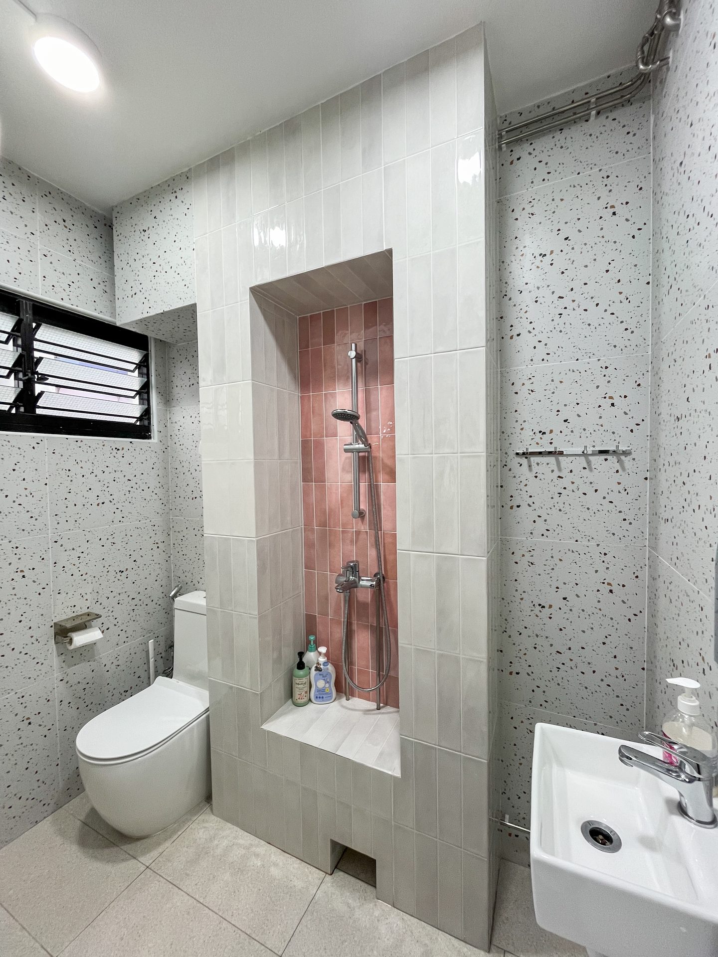 Pink Kitkat tiles from hafary against terazzo look tiles from Hup Kiong