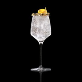 A closeup of a New Year's Effervescence drink against a dark background.