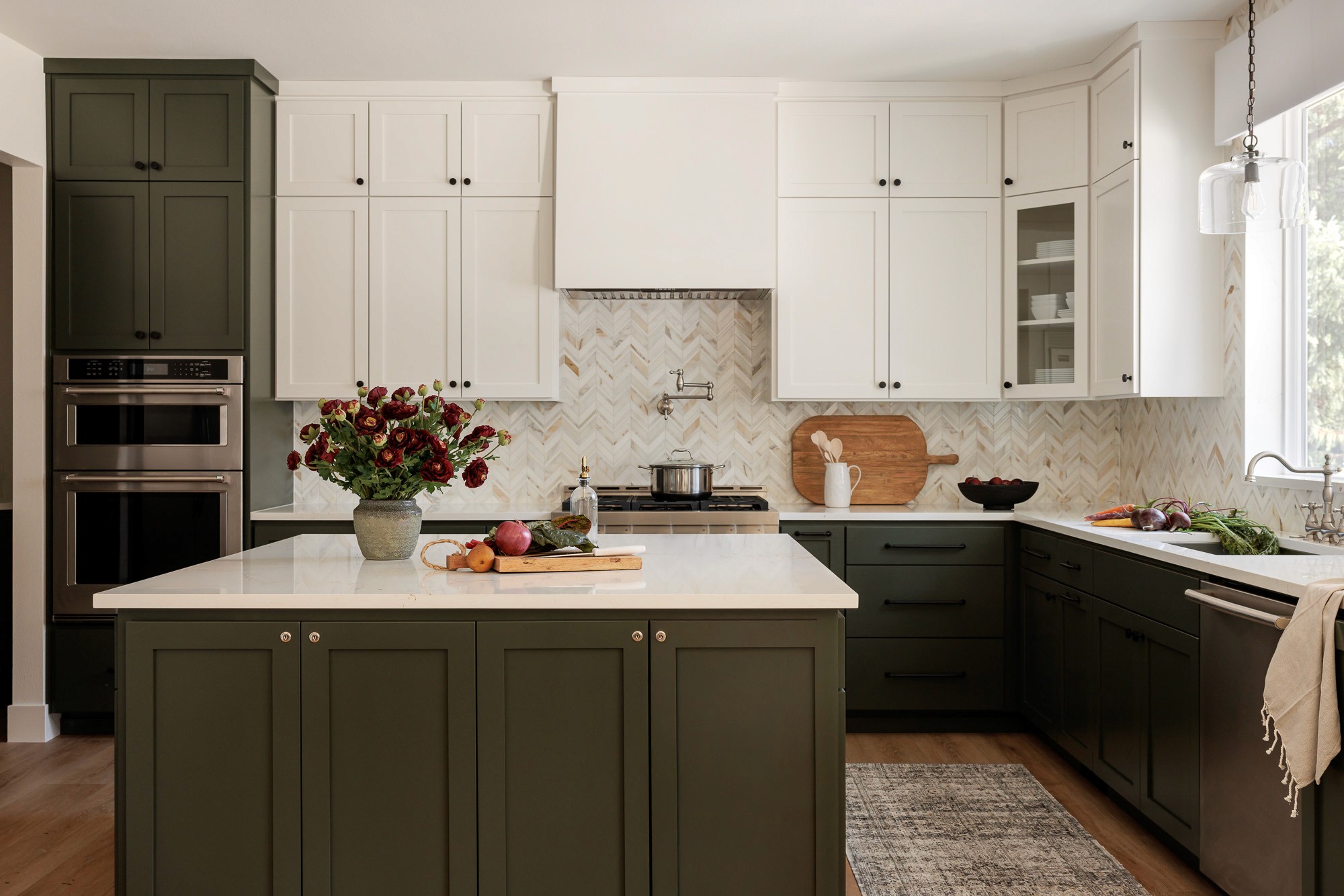 The kitchen in the Ravensdale House Project designed by Elegant Simplicity in Seattle Washington