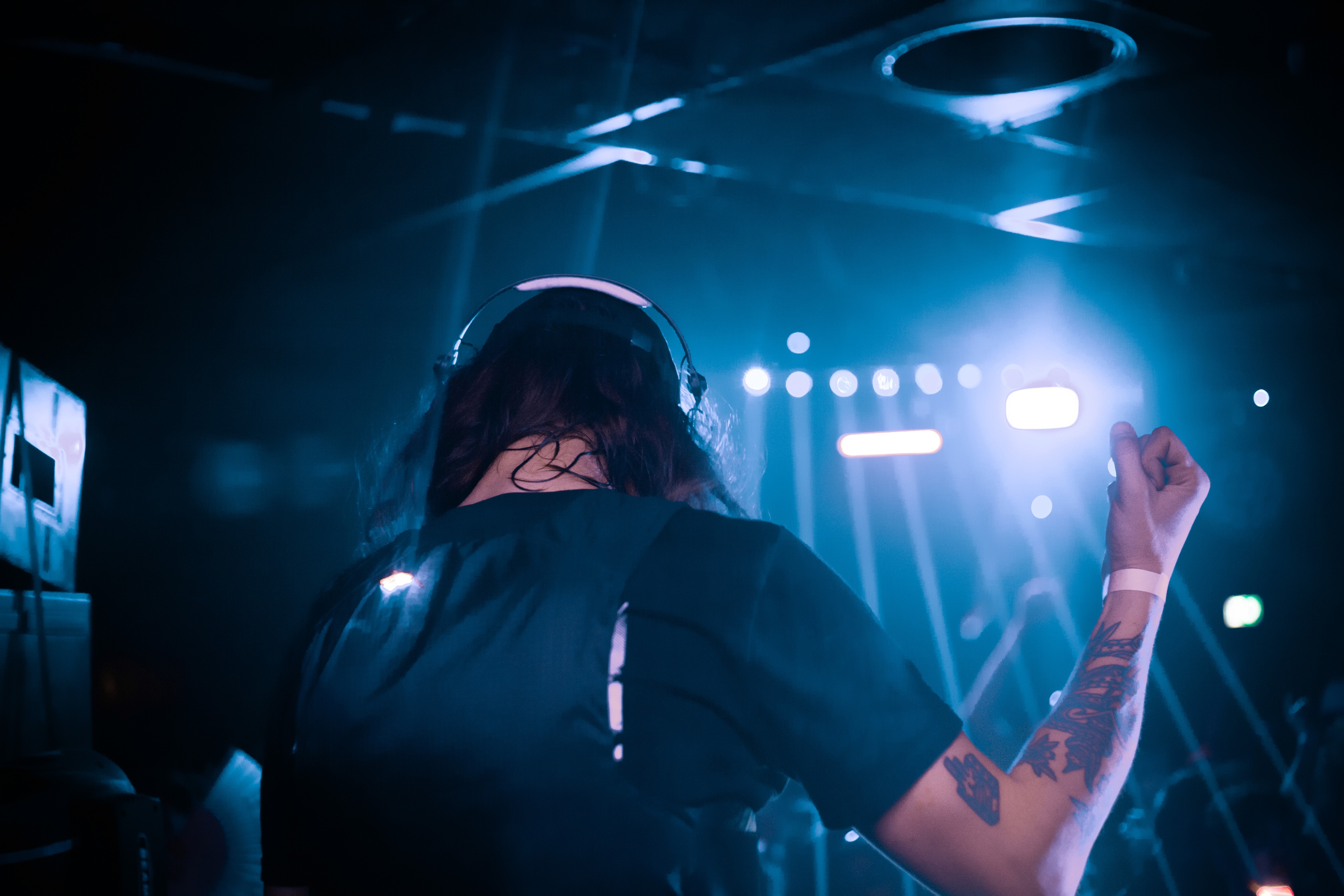 a man djing with a blue stylish vibe