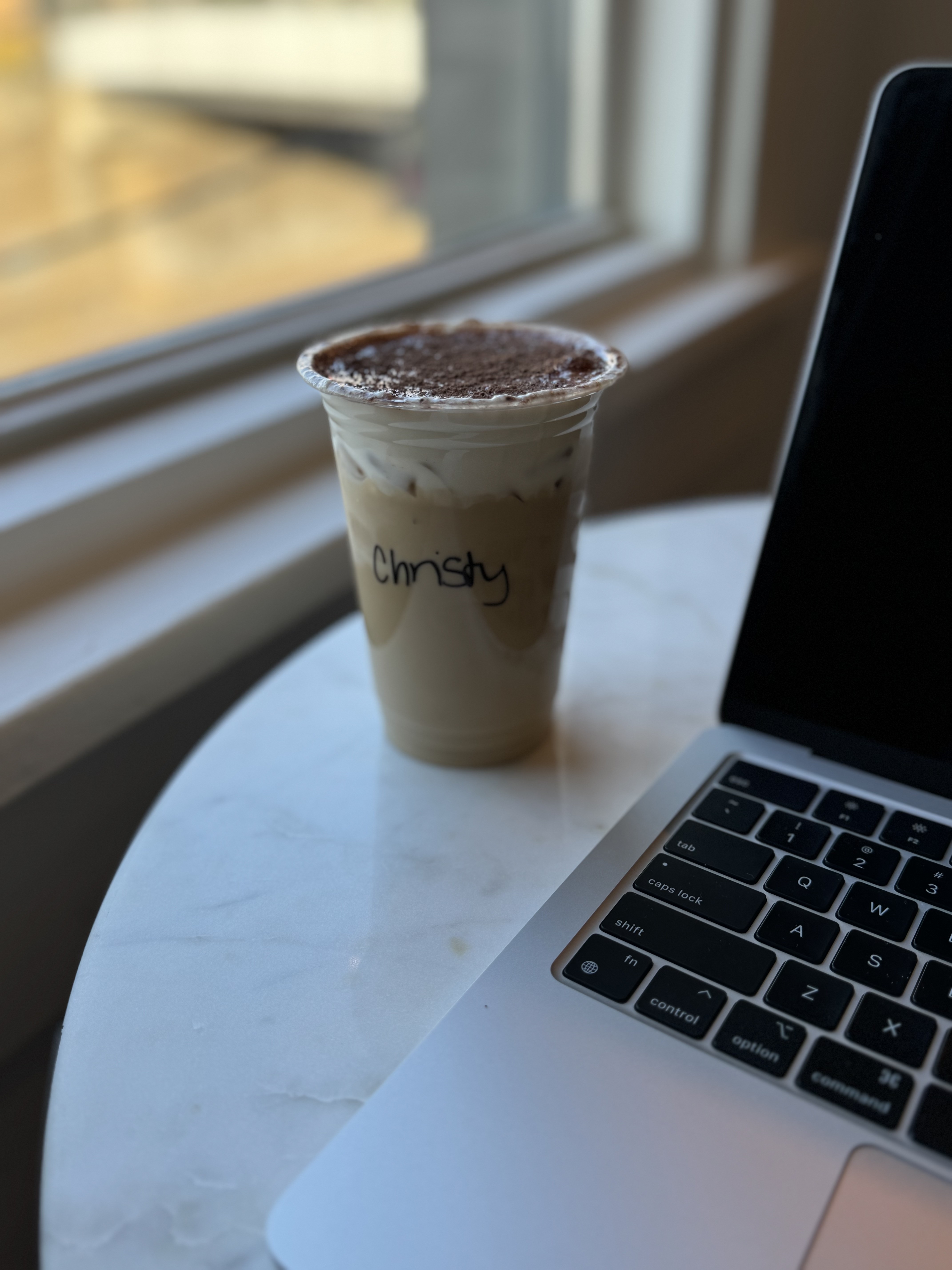 Abstract close-up image of green and white textured fabric or grass in soft motion blur.