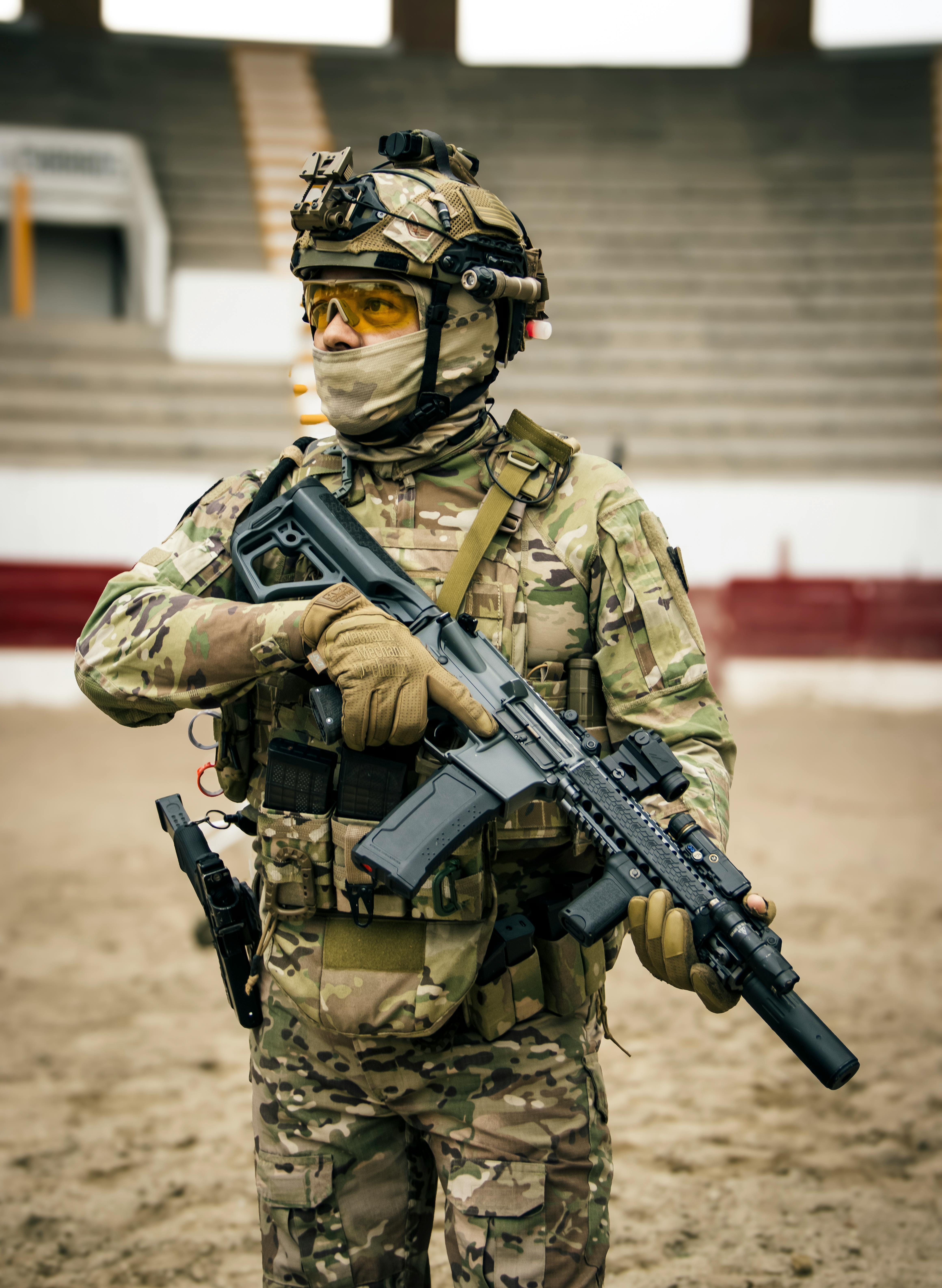 Liaison officer in uniform communicating via radio or briefing with allied units in a tactical setting.