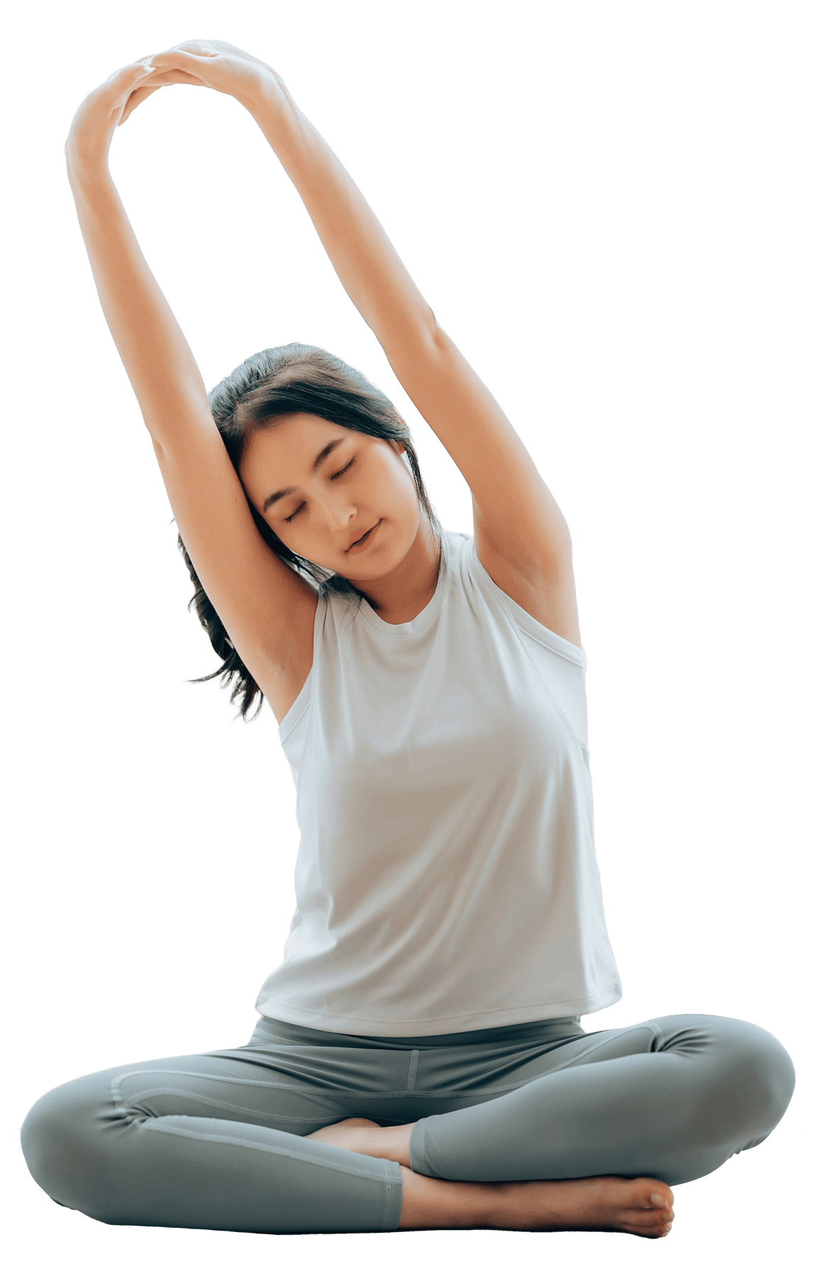 A woman sits cross-legged with eyes closed, wearing a white blouse and a long purple skirt, looking serene.