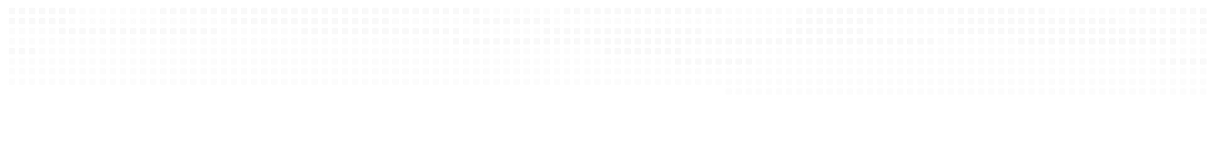 A row of white fence posts supporting a white fence, creating a clean and uniform appearance.