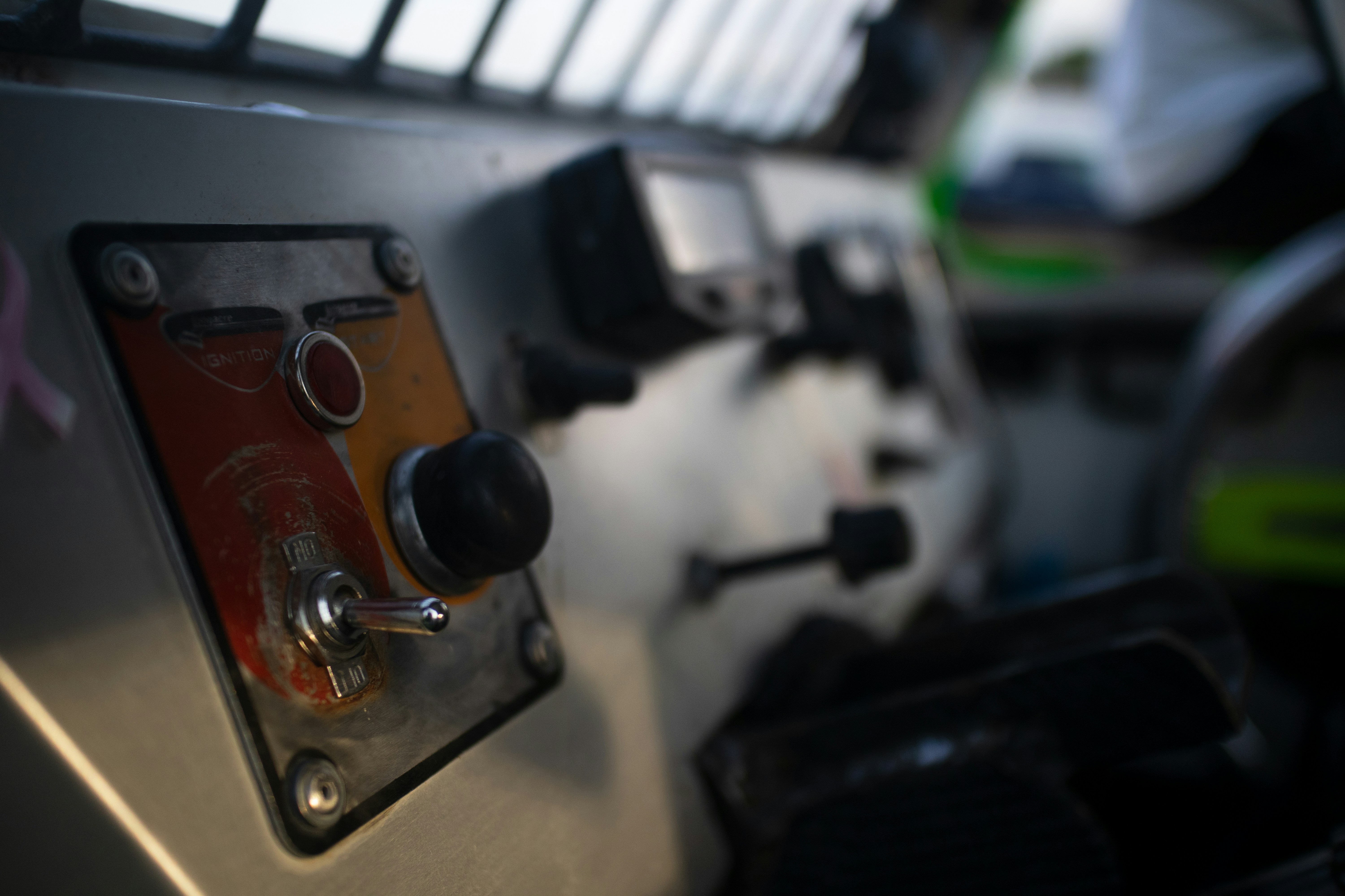 Close-up of excavator cab control panel switches