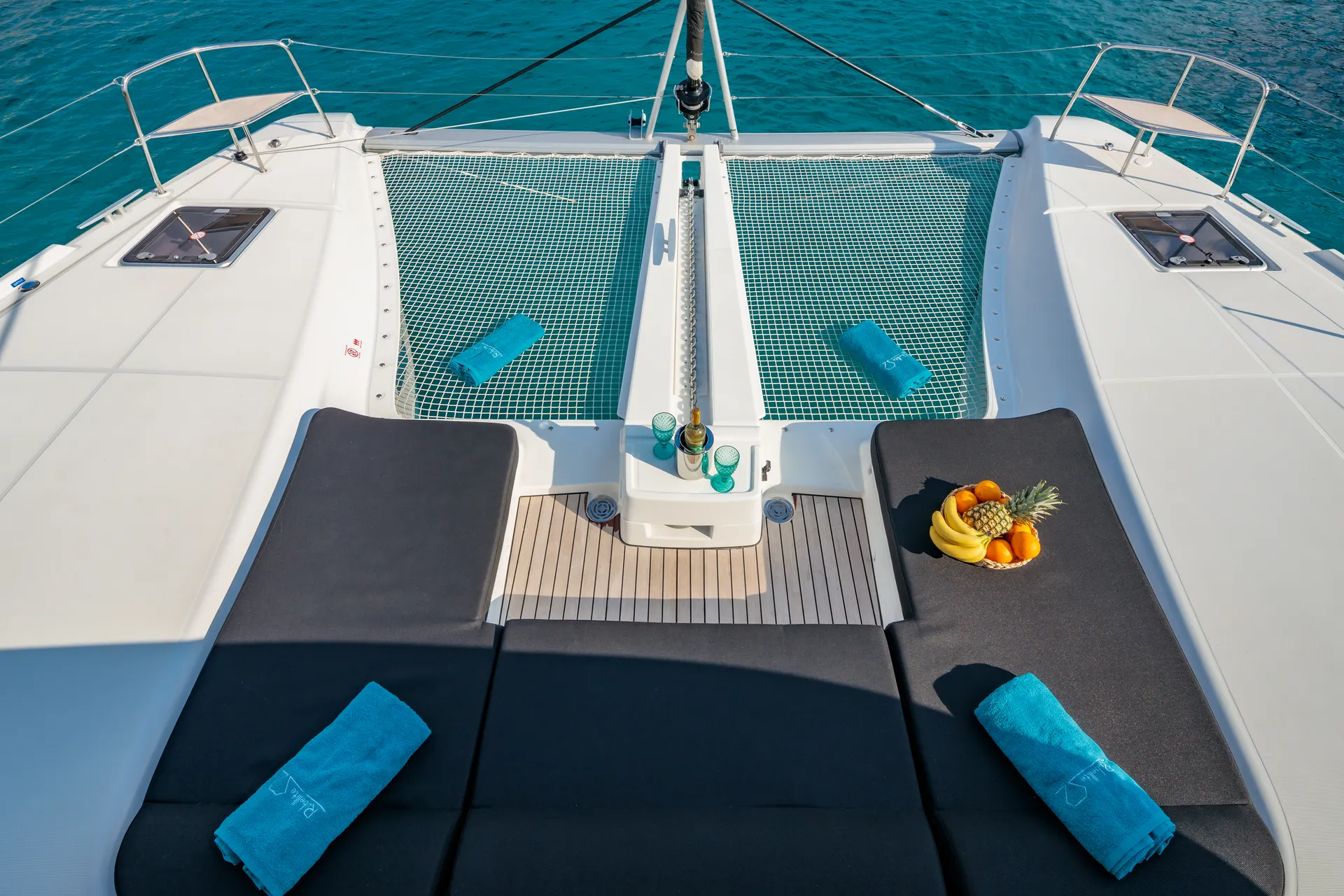 White Rock 36 speedboat with captain at helm cruising calm blue waters near Paros coastline with hills in background.