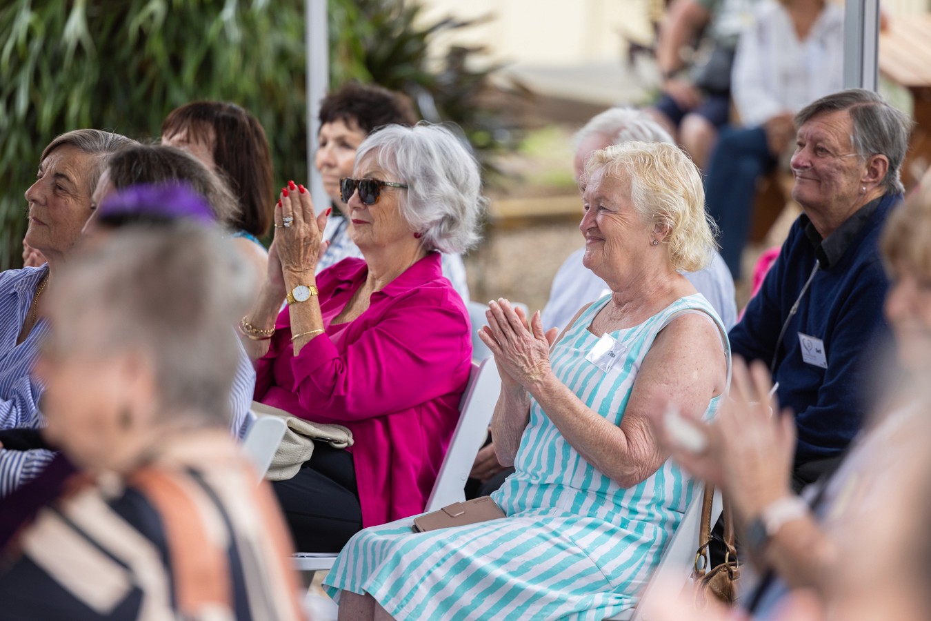 Women clapping in audience